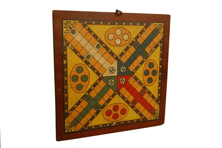 This early diminutive game board shows vibrant original colors it measures 14 inches by 14 inches.