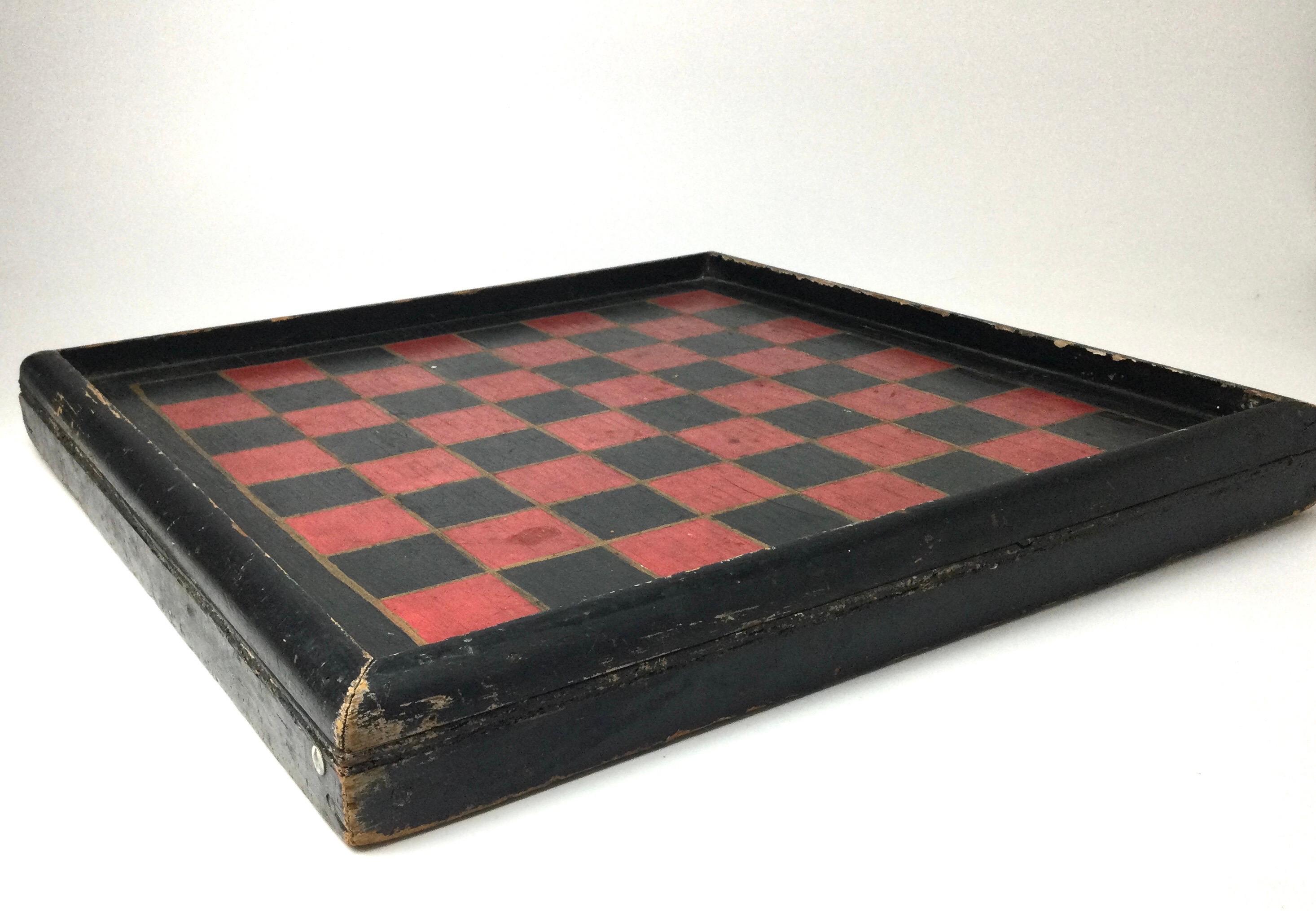 19th century game board in original painted red and black original surface. Hand painted red and black with gold lines between boxes. Nice old early condition with age appropriate wear to the paint. 20
