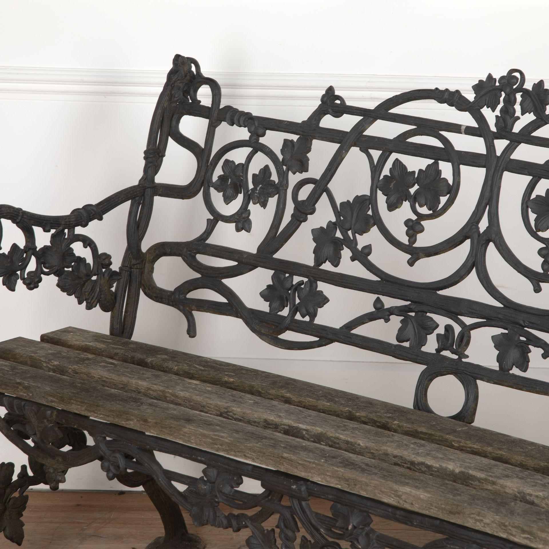 19th century Coalbrookdale ivy leaf motif cast iron garden bench, with slatted wood seat.