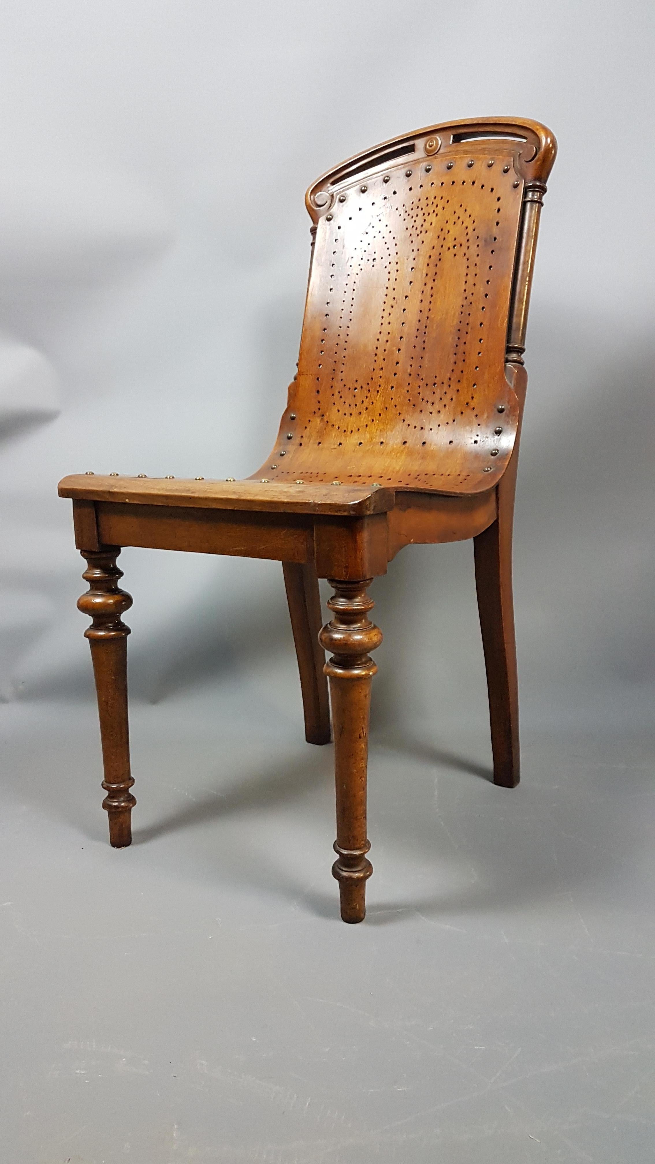 A beautiful, elegant and charming chair by Gardner and Co. The seat is molded perforated birch plywood with the frame being predominantly walnut. The frame bares the patent number 31893 while the ply seat bares the number 1253.

Similar examples