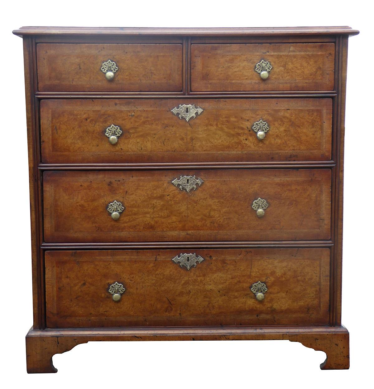 For sale is a good quality George III burr walnut chest of drawers. The chest has an arrangement of five drawers and stands on bracket feet. Each drawer has an ornate brass drop handle. This piece is in excellent condition having been fully