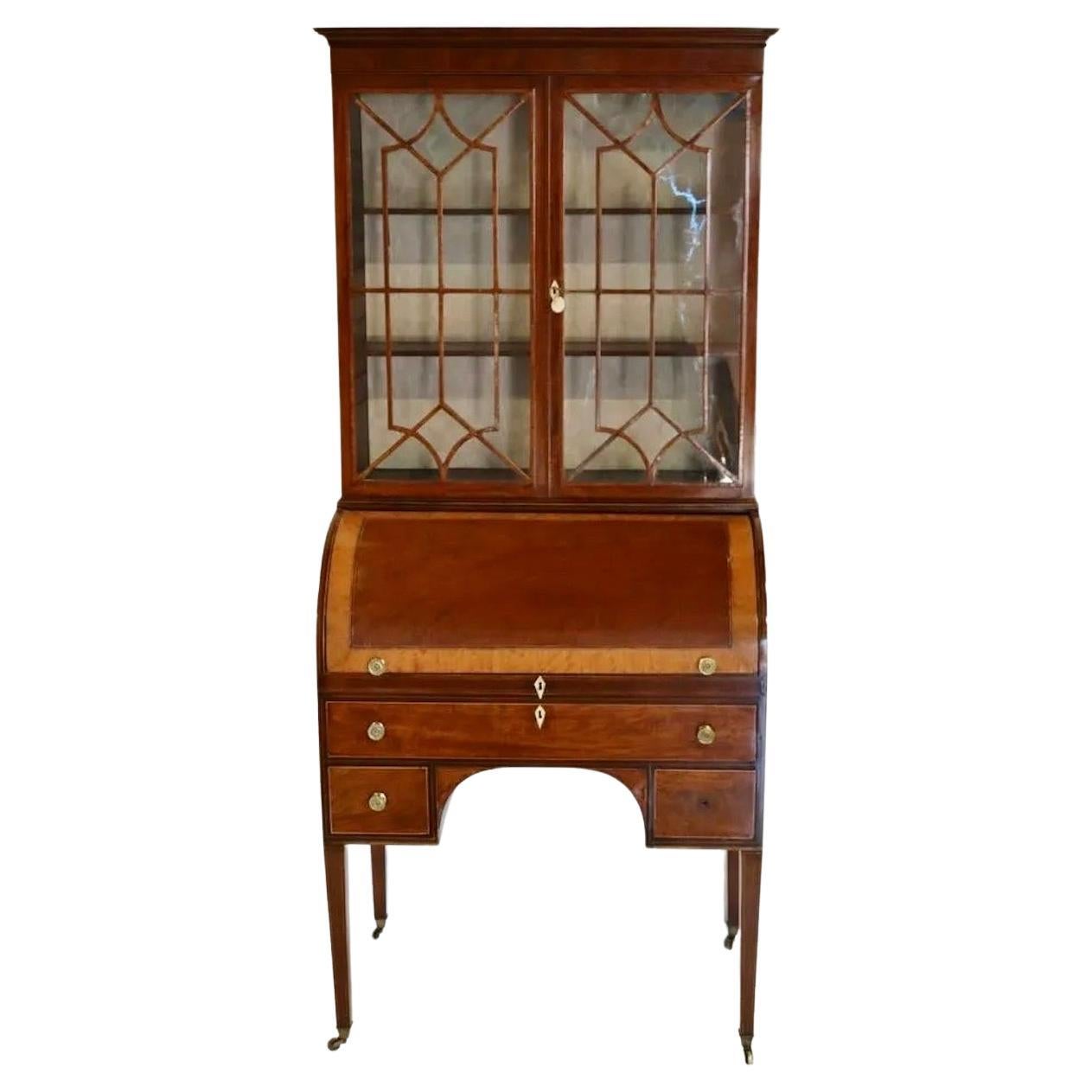 Period Mahogany George III Hepplewhite Cylinder Top Secretary Bookcase.  Tapered Legs.  Maple inlaid top.  Interior reveal leather writing surface and pigeon hole compartments.  Beautiful execution and wonderful size