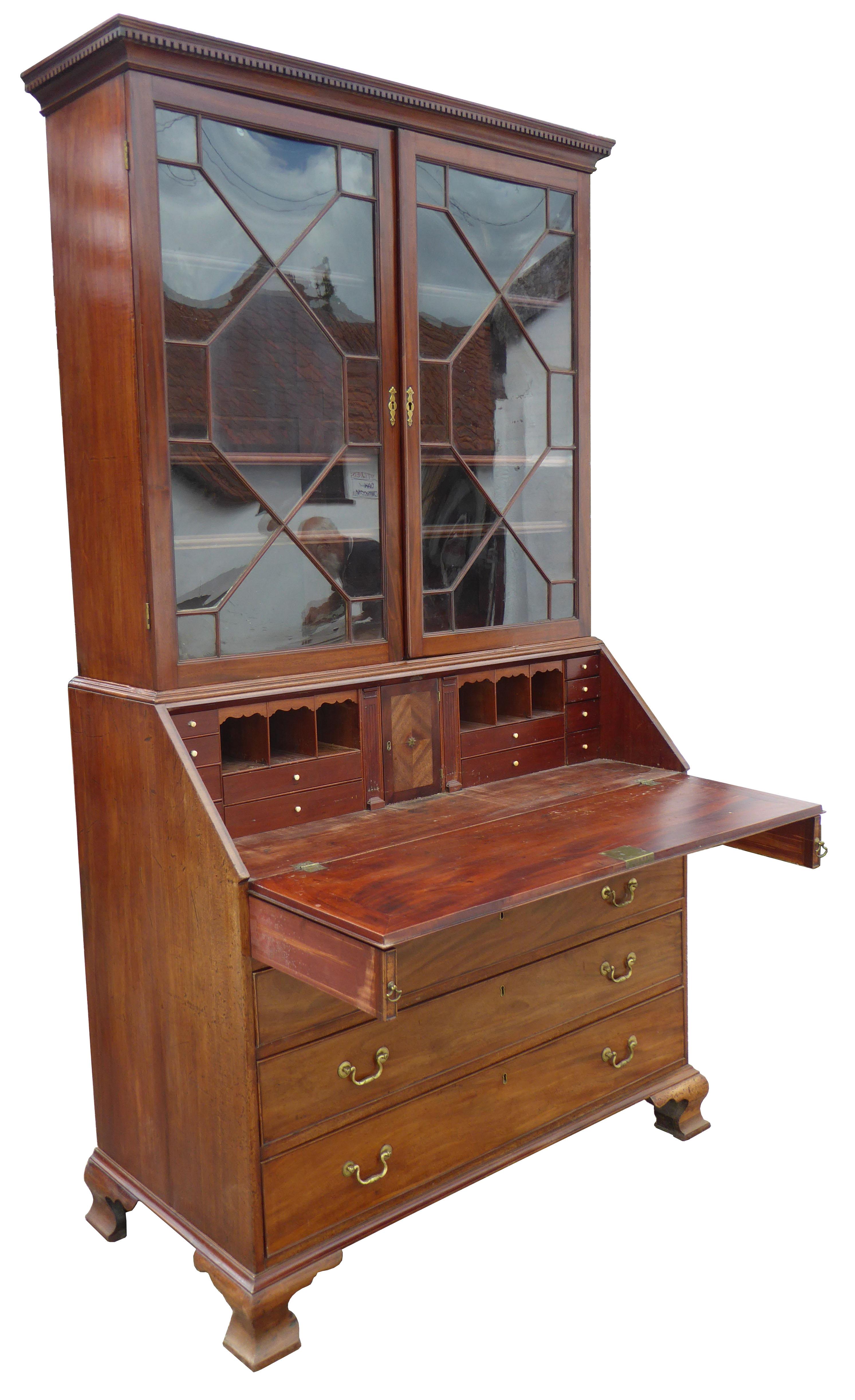 For sale is a good quality George III mahogany Bureau bookcase. The bookcase top has two astregal glazed doors, opening to reveal adjustable shelves. Below this is a fall front, opening to a fully fitted interior consisting of various drawers,