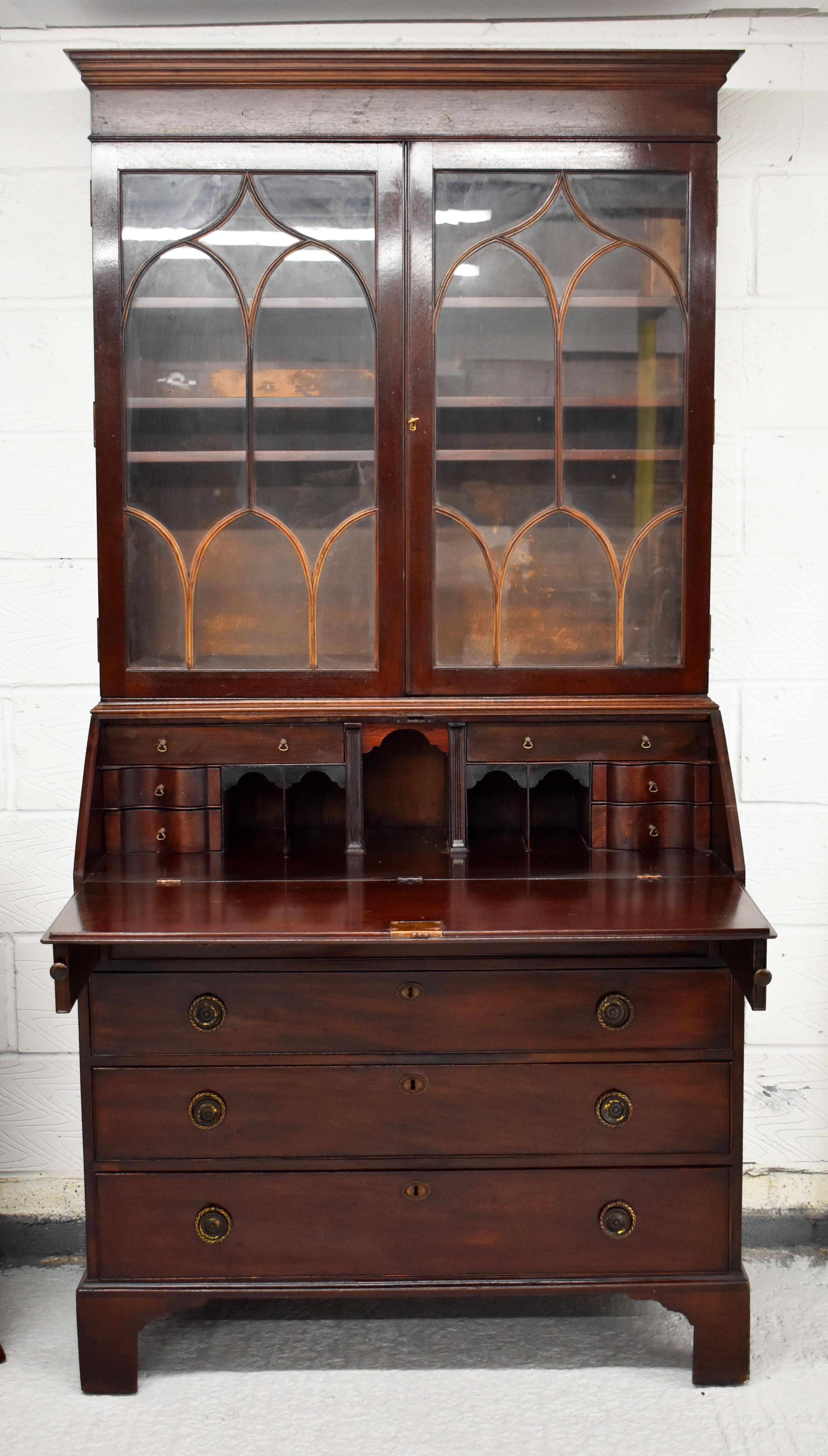 For sale is a good quality George III mahogany bureau bookcase, with glazed doors to the top, with a nicely fitted interior below, the bookcase remains in good condition, showing minor signs of wear commensurate with age and use.

Measures: Width