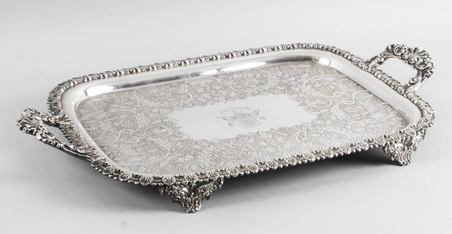 This is a lovely antique English Old Sheffield Silver Plate tray, circa 1830 in date.

This rectangular Old Shefield tray features a deep set, decorative border with elegant handles to each end and superb foliate and floral chased and engraved
