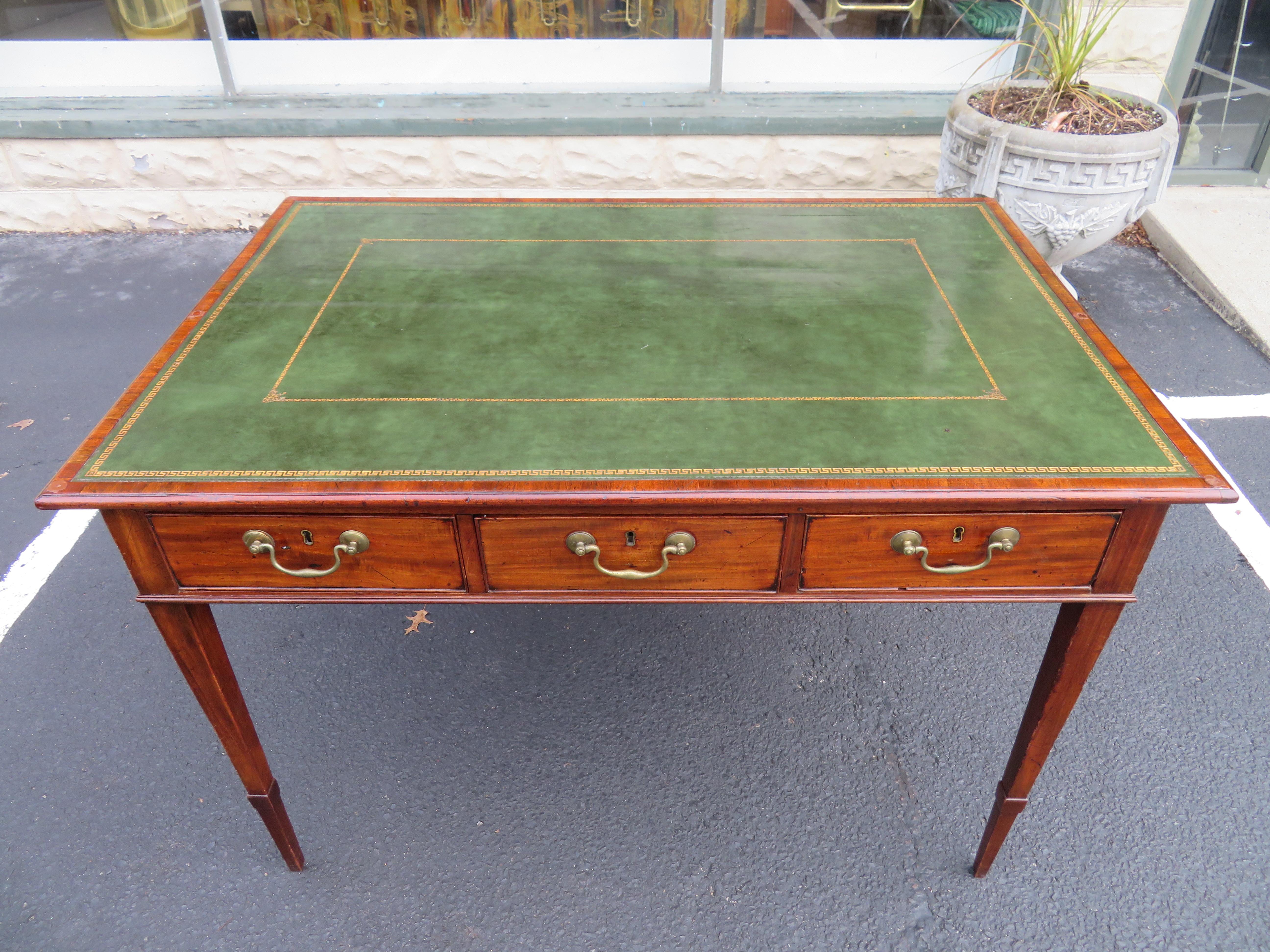 Antique George III leather and mahogany double sided partner writing table desk. We love the original tooled green and gold inlayed leather top against the nicely aged patina of the mahogany wood-very charming in-deed! A very attractive writing desk