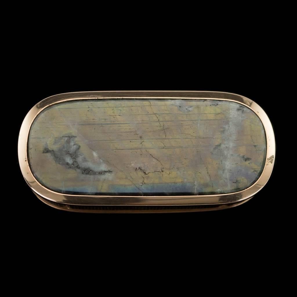 Antique 19th century Georgian 18 karat solid gold-mounted hardstone snuff box, elongated with rounded corners, engine turned and the lid and base mounted with a polished labradorite. Lid and base set with plain slightly protruding boarders acting as