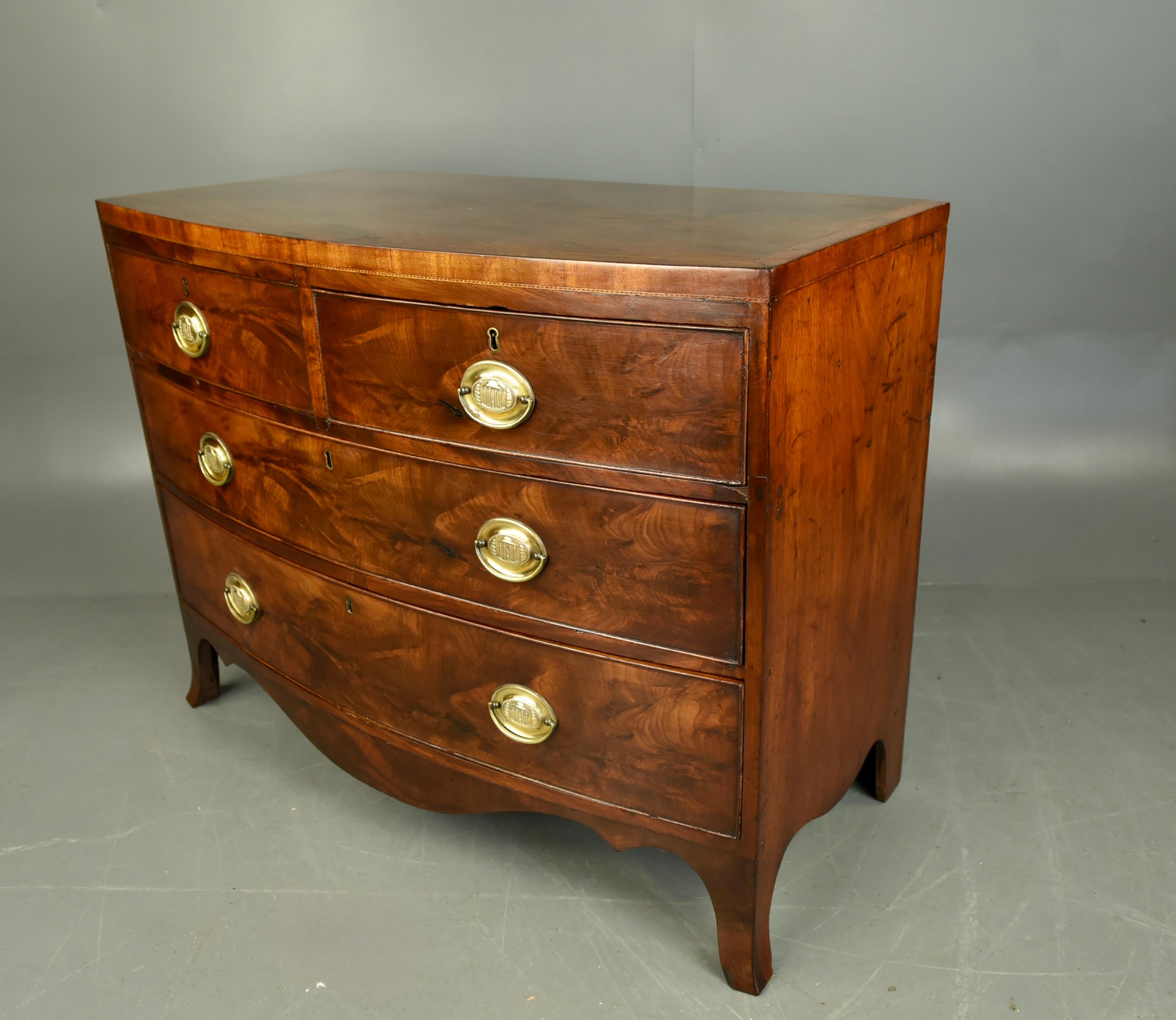 Fine Georgian mahogany bow front chest of drawers circa 1810 .
The chest of drawers consists of two small over two large drawers that are have dovetail jointed and all slide as they should .
The chest has very good figuring and a great colour  with