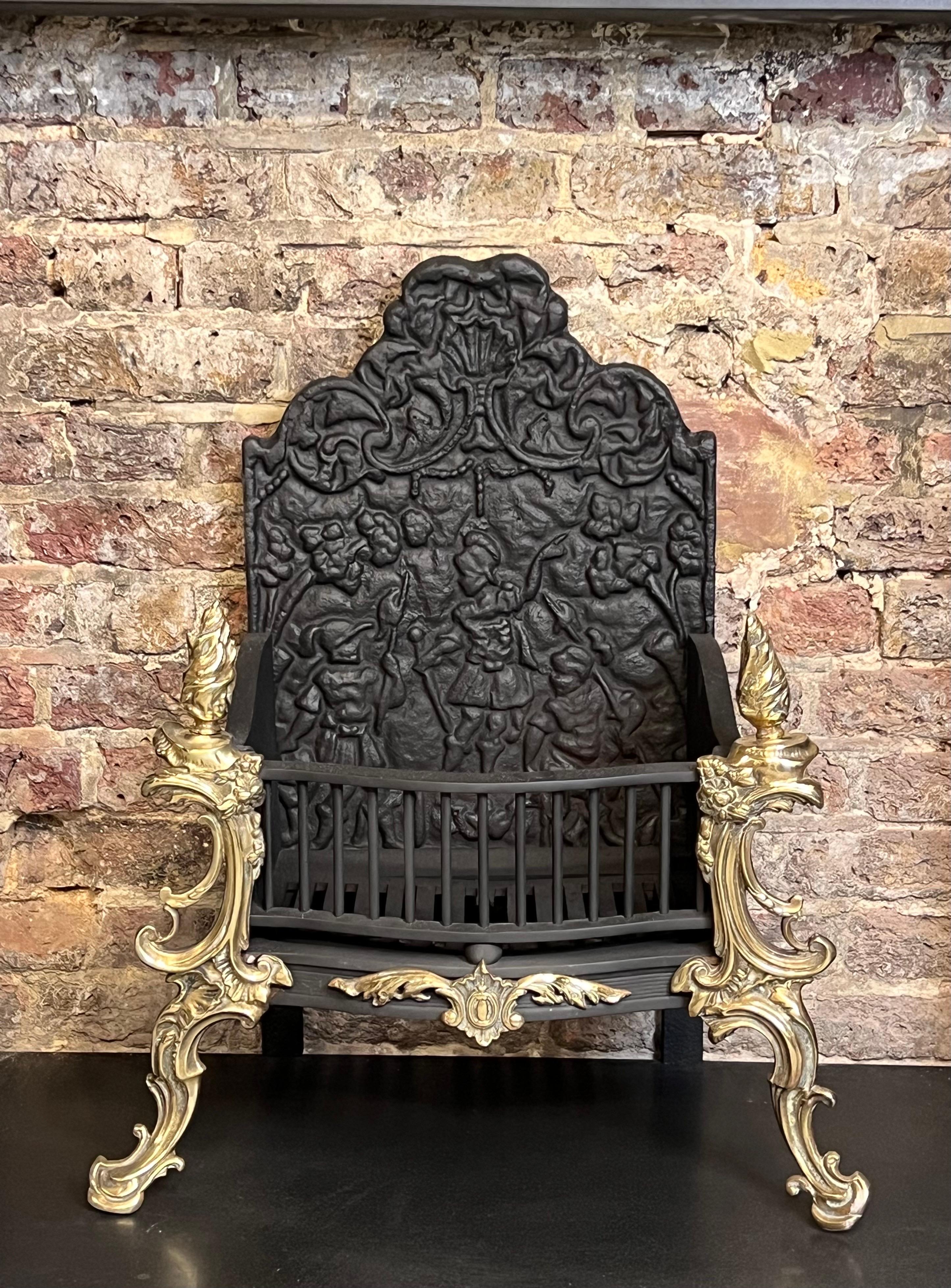 19th Century Georgian Cast Iron & Brass High Back Fire Basket Grate
Recently Salvaged From A London Town House. 
A Remarkable Fine Piece, This Antique Fireplace Basket Is Flanked With Detailed Brass Work To Its Legs & Torch Like Finials,
With An