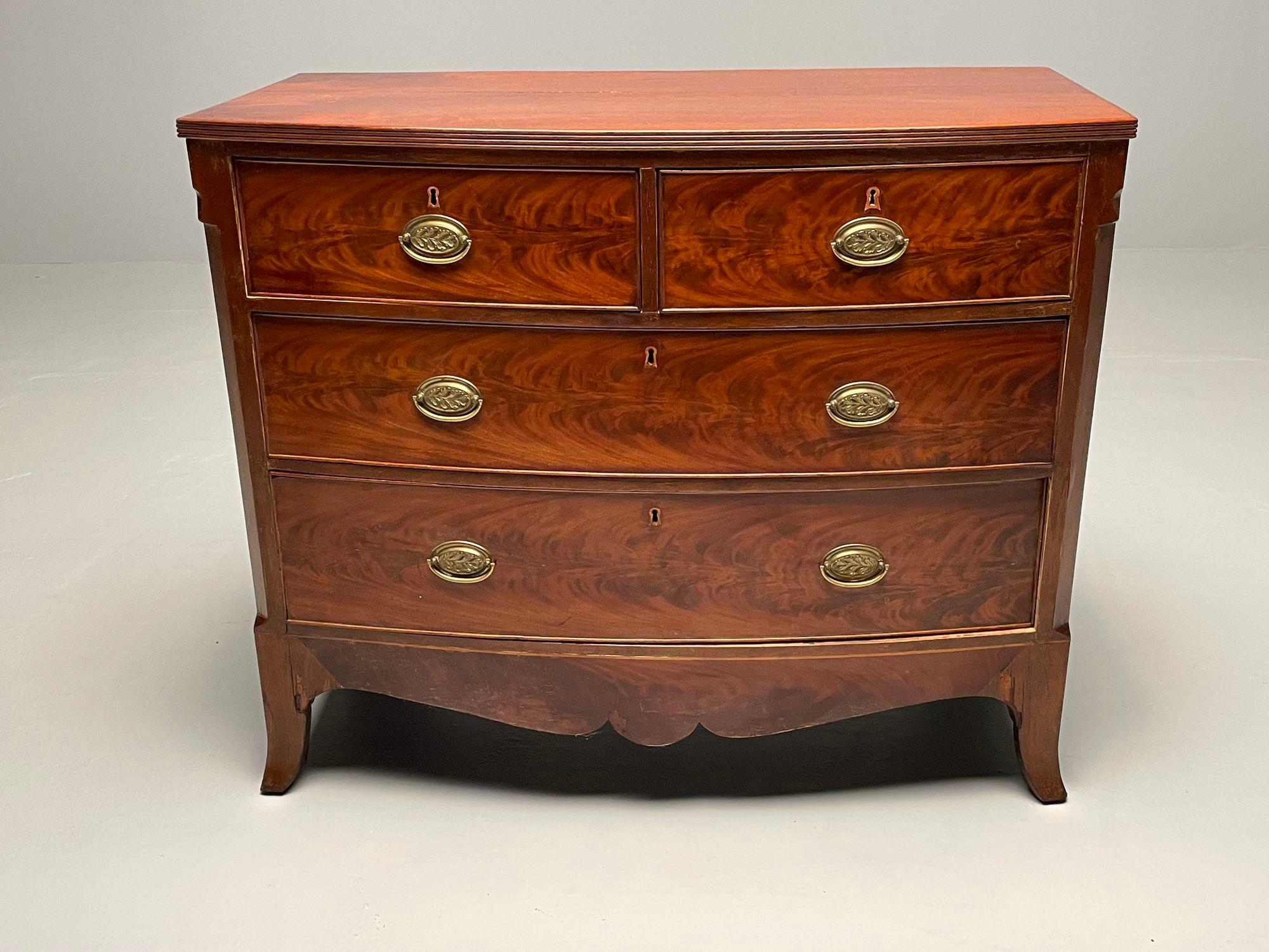 19th Century Georgian Flame Mahogany Bow Front Commode / Chest of Drawers or Nightstand

A fine example of a two over two chest having its original hardward and sprayed legs. Good condition with some minor veener restoration, stratches and the like