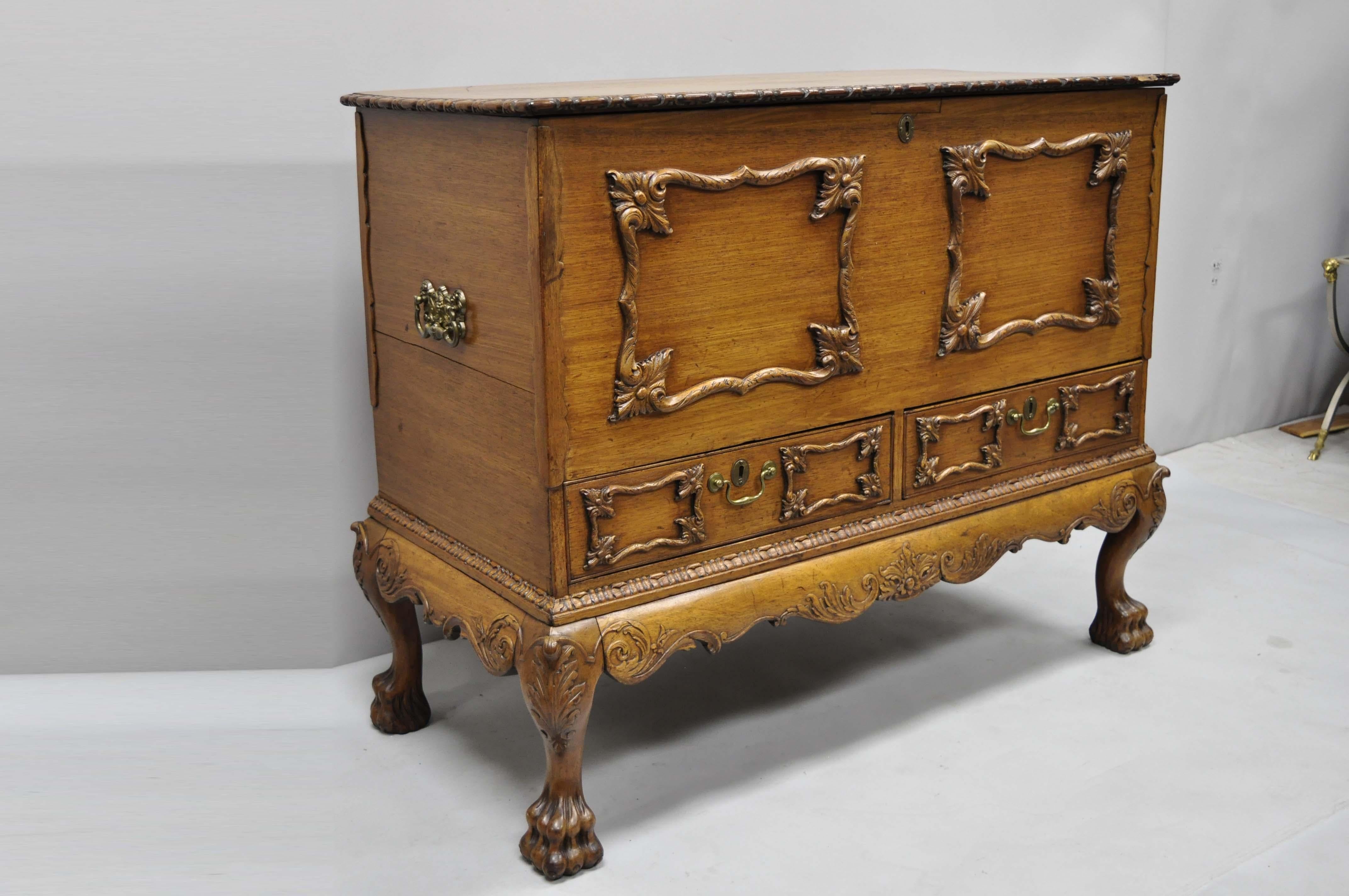 19th century Georgian George II Style mahogany paw foot coffer blanket chest. Item features brass figural handles, solid wood construction, beautiful wood grain, finely carved details, 2 dovetailed drawers, carved paw feet, very nice antique item,