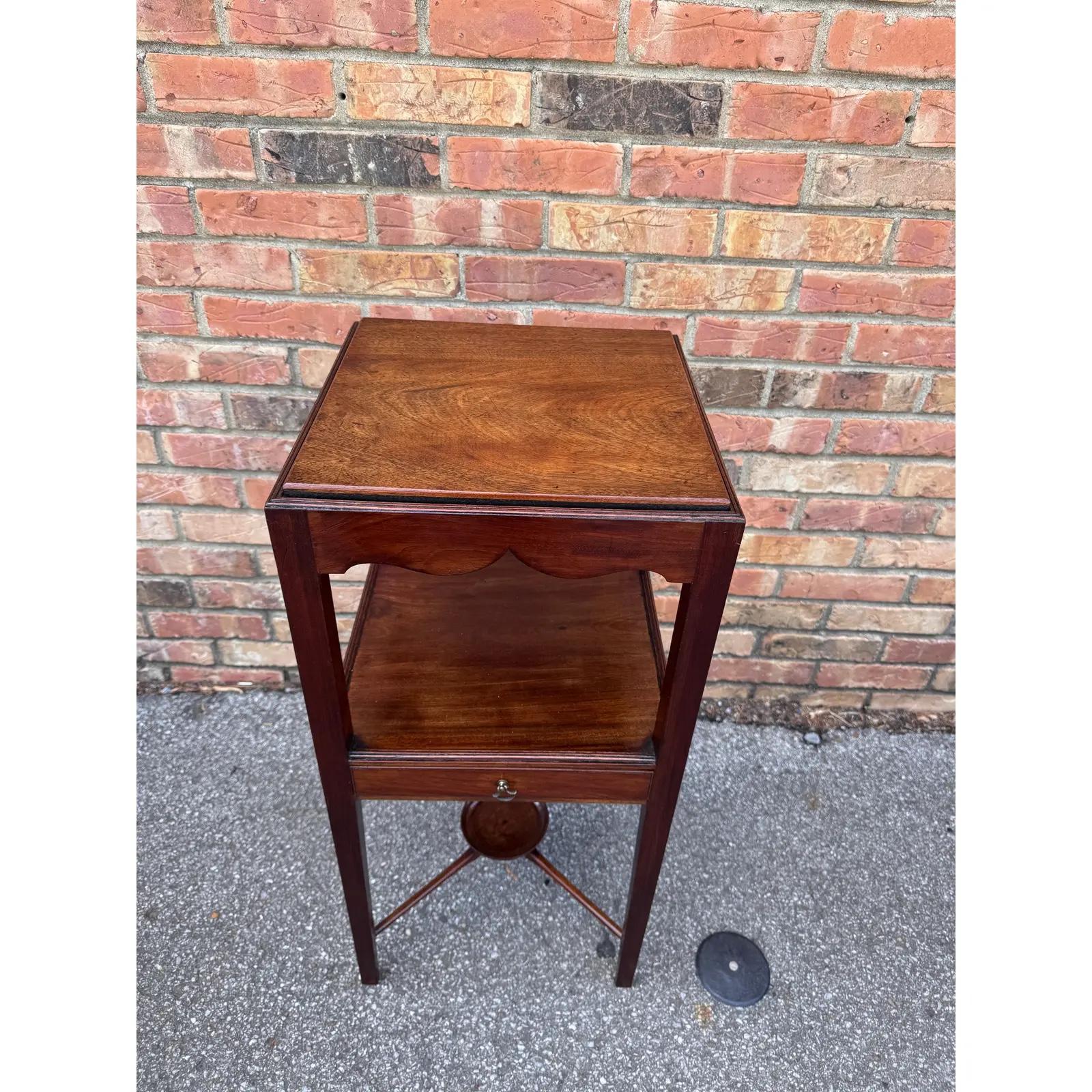This is a lovely Georgian Mahogany washstand or bedside table fitted with square chamfered legs with a cross stretcher support shelf. It's a versatile side table for so many areas of your home. 
Dimensions
14ʺW × 14ʺD × 30ʺH
