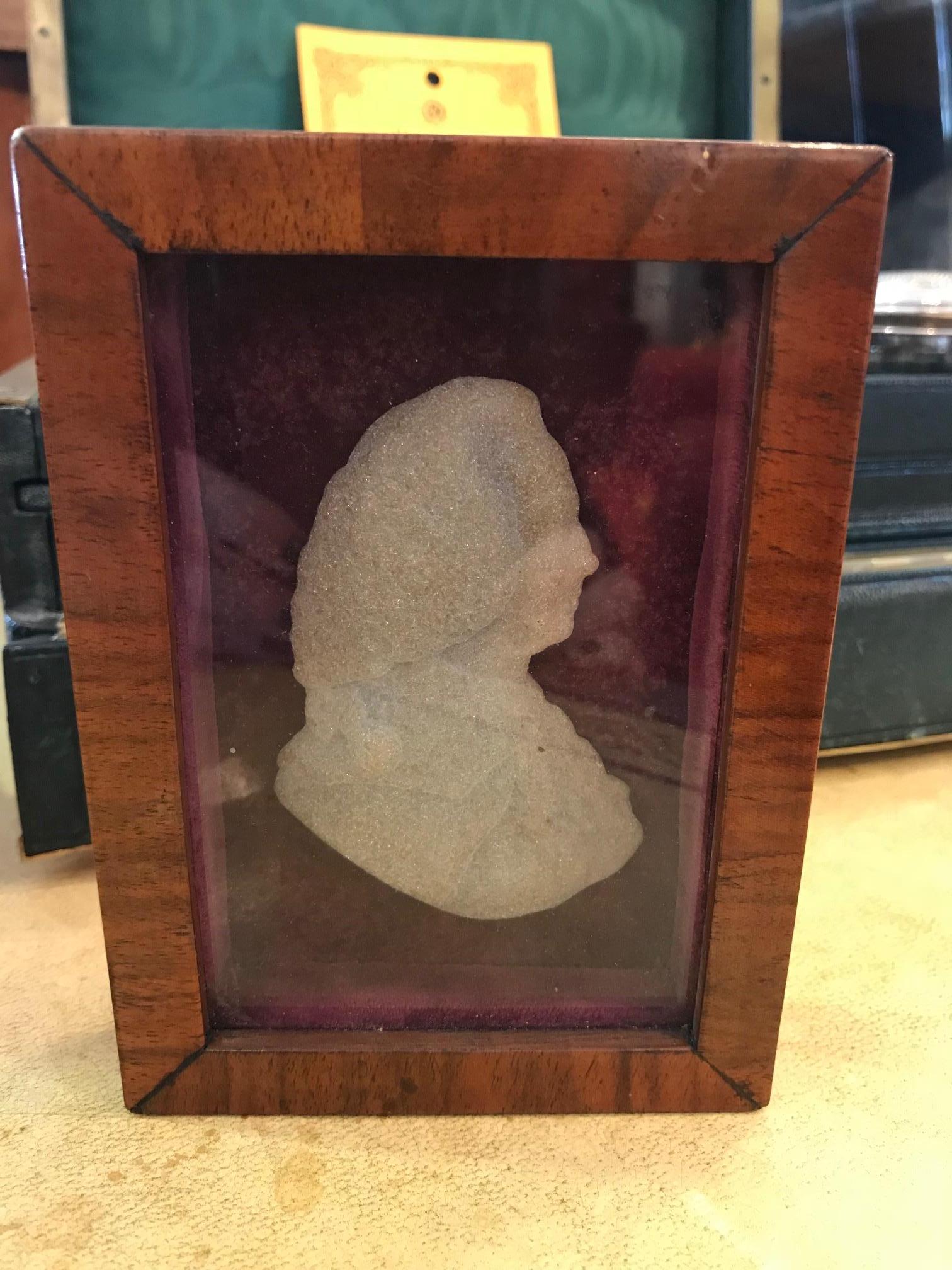 A Georgian profile portrait of a gentleman carved from Pentalic marble. Possibly
'The Old Pretender', cousin of the Duke of Cumberland, House of Stewart.