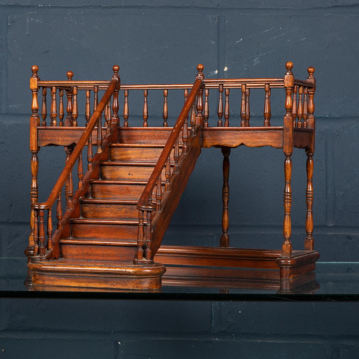 A superbly detailed miniature stairway made in England around the middle of the 19th century. This particular model is a single staircase leading to a balustraded gallery. Miniature staircases were produced by architects and furniture makers as