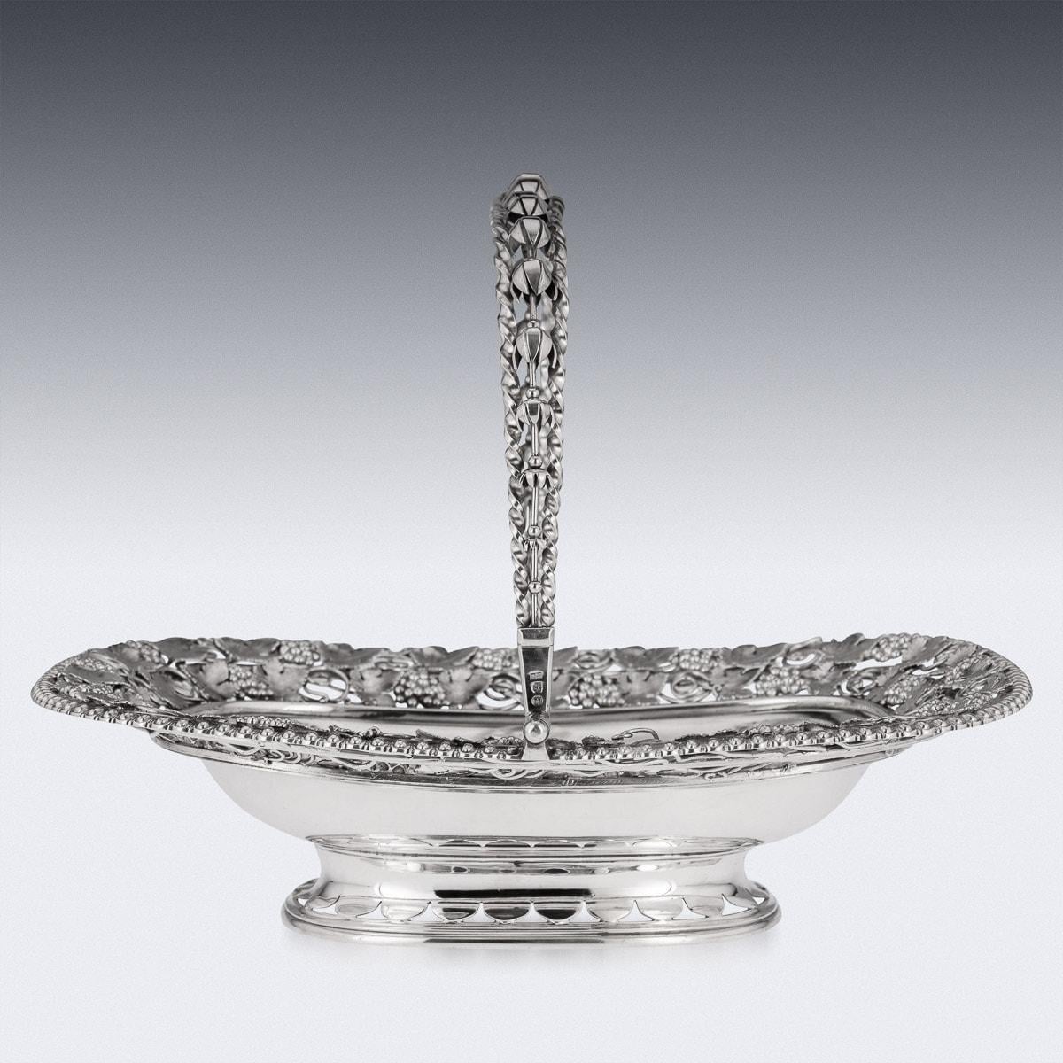 19th Century Georgian silver basket, standing on a pierced oval foot, the shaped oval body applied along the sides a with cast grapevine and gadrooned boarder, a very unusual swing handle created from a twist metal rods and centered with flower