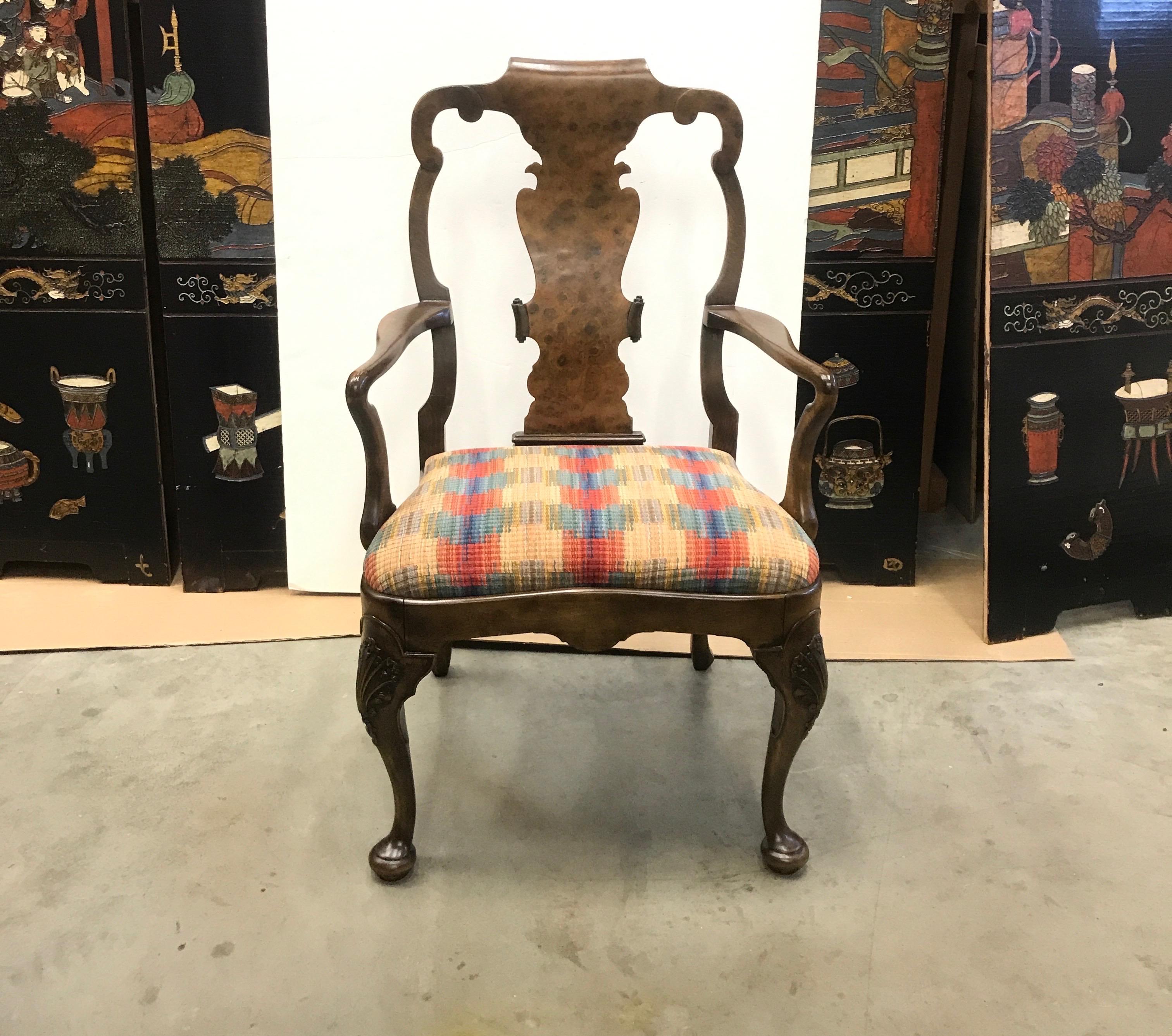 Elegant hand carved walnut fiddleback broad arm chair. The figural burled walnut with solid frame and hand carved details on the knees of the legs. This chair is broader than a dining arm chair and a very comfortable option for a desk chair.