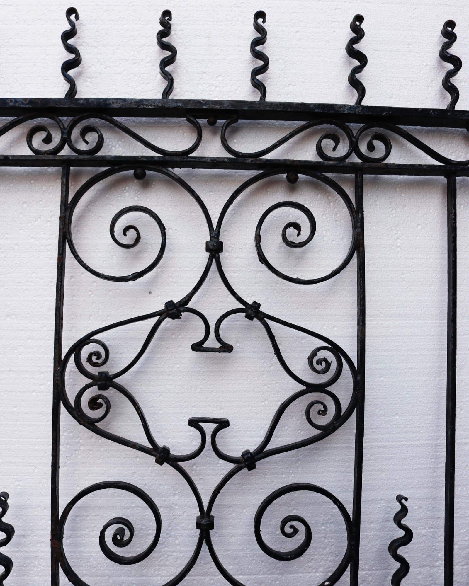 Mid-19th century Georgian wrought iron pedestrian gate with a wavy design. This gate’s large size, tall stature, and unusual design would leave a quirky aspect to any English property. Scrolls hold their place on both ends, while its centre holds