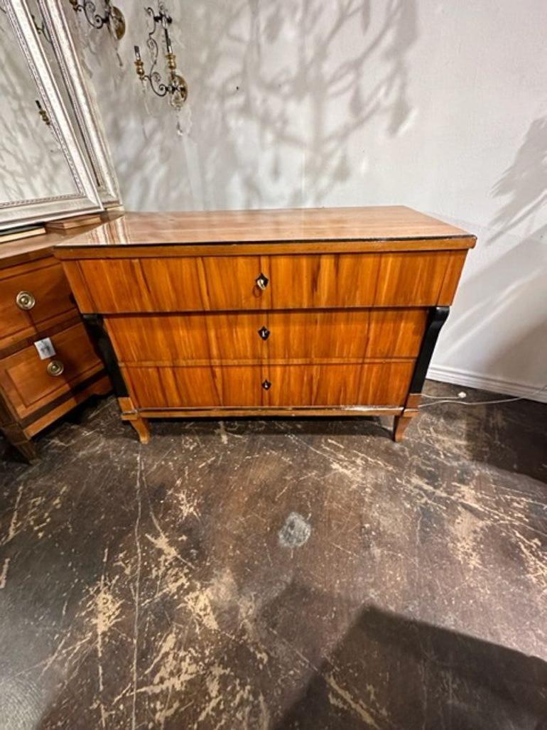 Handsome 19th century German Biedermeier cherrywood commode with ebonized details. This piece has a very fine finish, clean lines and high-quality construction. Superb!!