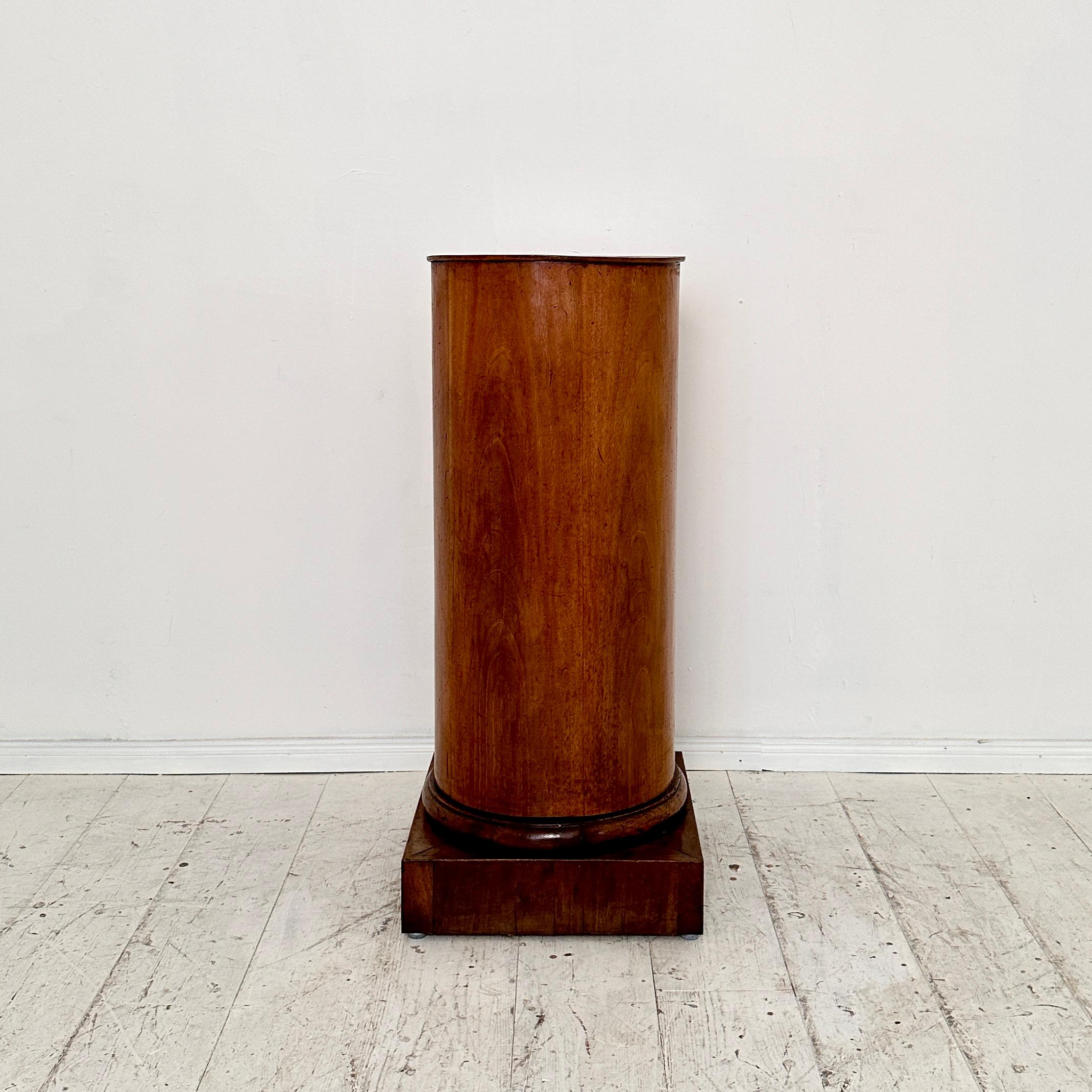 Crafted around 1820, these Rare 19th Century German Biedermeier Column in Walnut are exquisite examples of the era's craftsmanship and aesthetic sensibility. Standing as elegant symbols of Biedermeier style, these columns boast a rich walnut hue