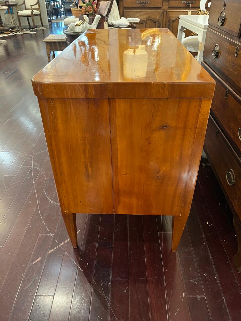 19th Century German Biedermeier Commode in Cherry wood. Pulls have been changed, and it has been refinished some time ago. Shows well.
