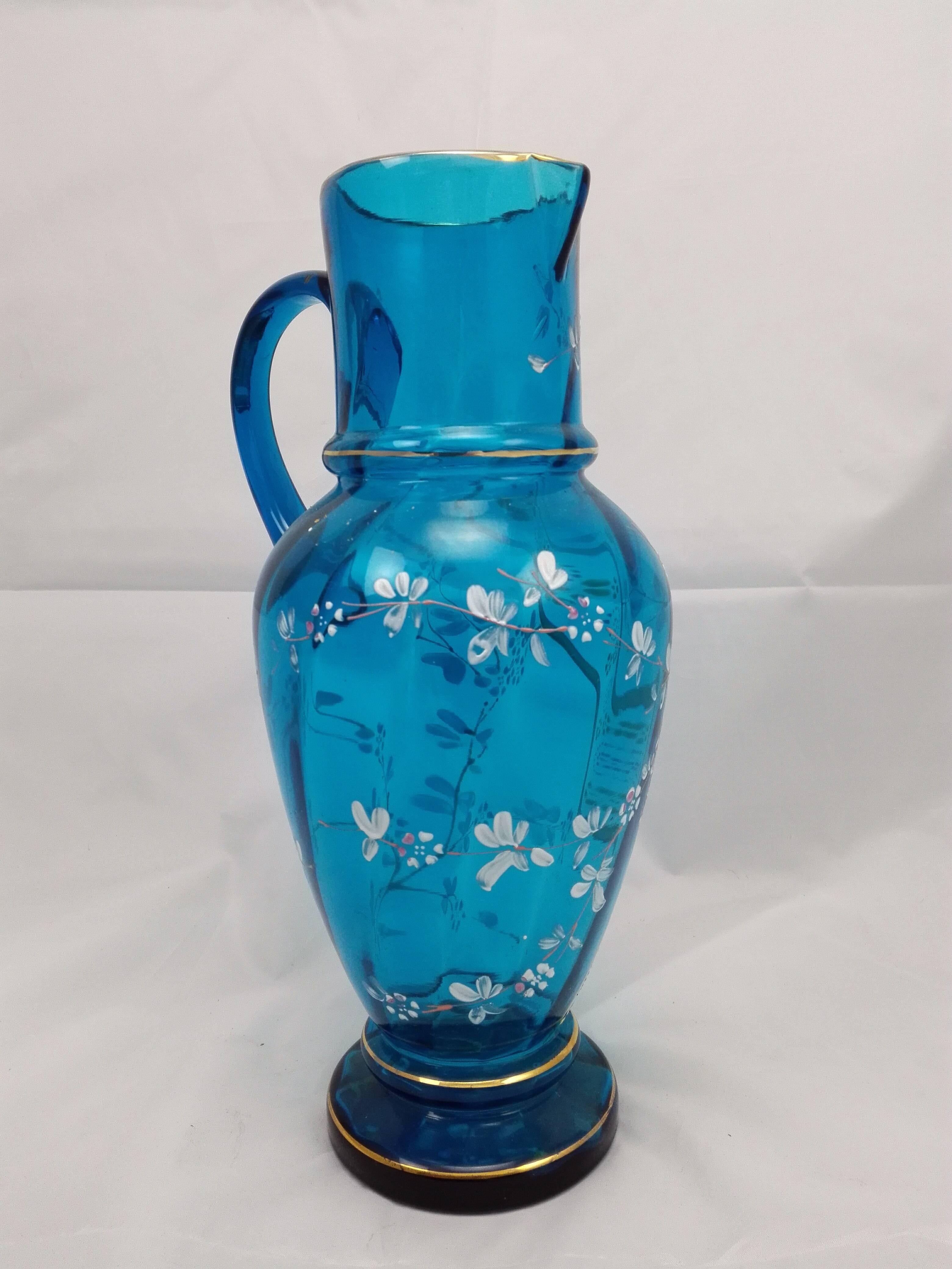 This wonderful German, mouth blown glass jug in light blue colour and hand-painted its one of a kind! In super condition with no cracks! Only clean it up and use! The design its just sensational!