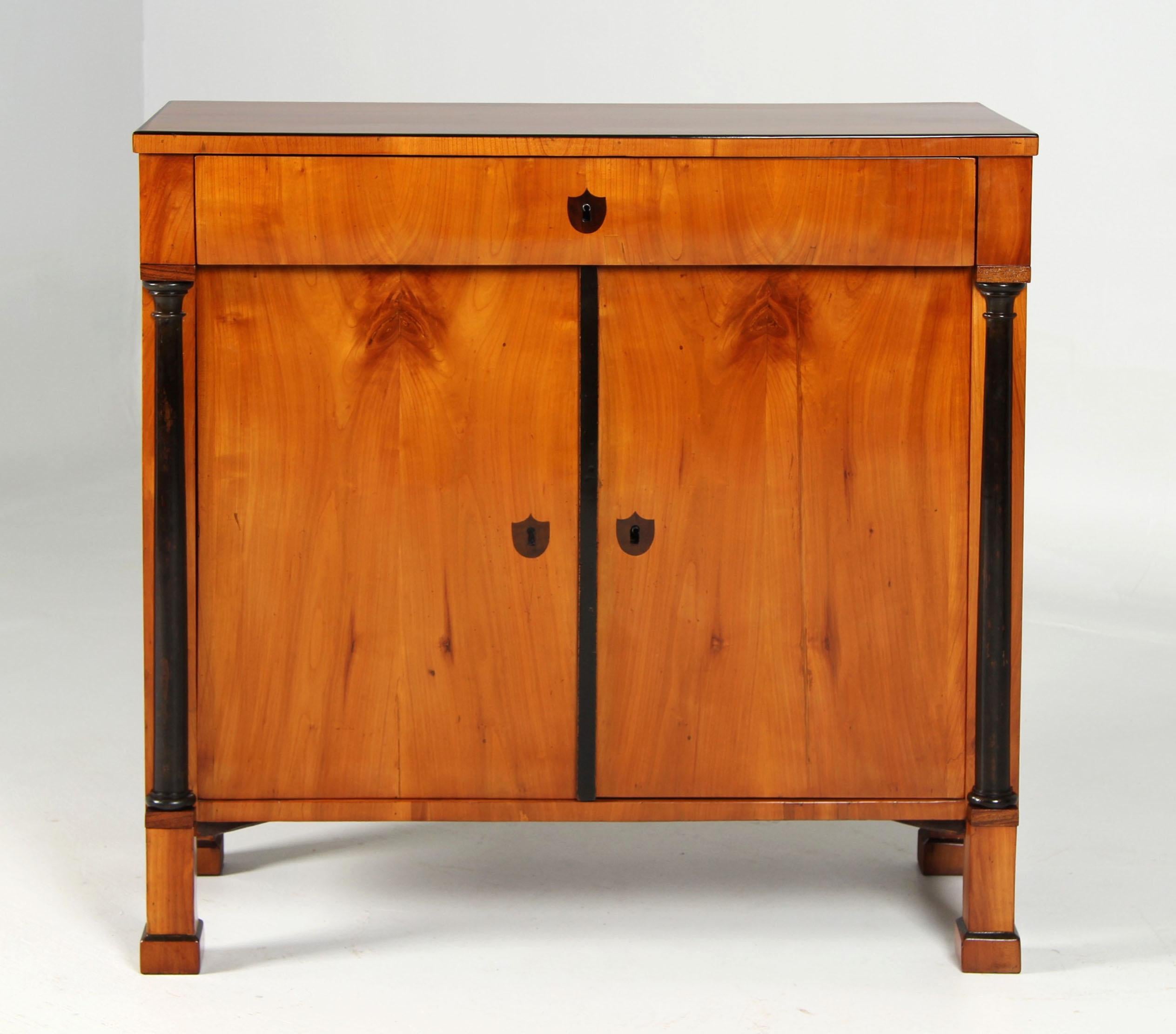 Biedermeier Sideboard

Southern Germany (Franconia)
Cherry tree
Biedermeier around 1825

Dimensions: H x W x D: 92 x 94 x 39 cm

Description:
Antique sideboard or demi-cupboard from the southern German Biedermeier period around 1825.

A piece of