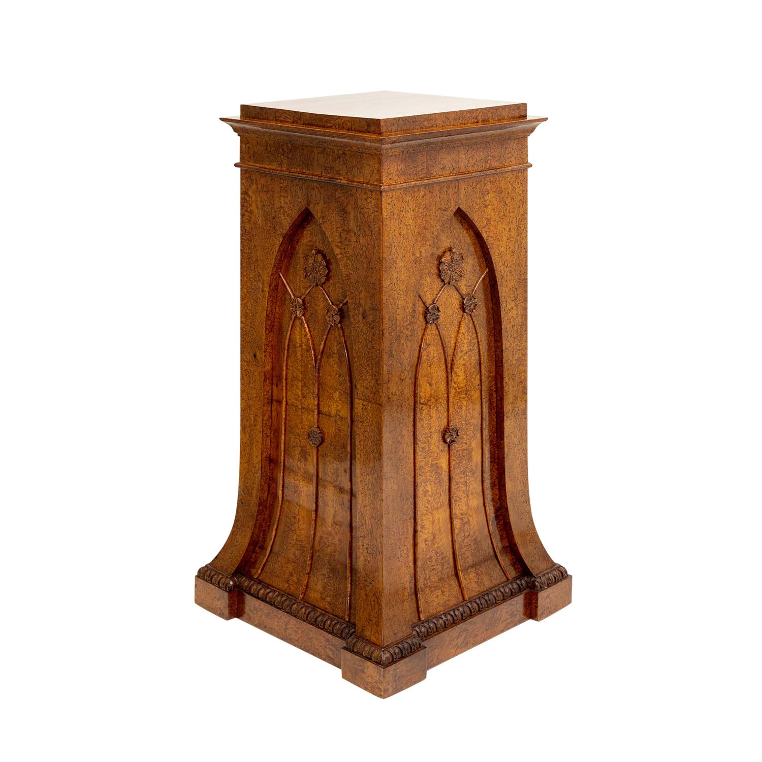 A 19th Century, antique German Biedermeier single pedestal made of hand crafted shellac polished, partly veneered Birchwood in good condition. The detailed center furniture, podium is enhanced on each side by flower carvings. Wear consistent with