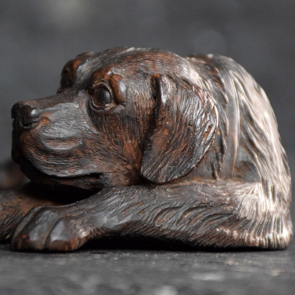 19th century Black Forest recumbent dog
We are proud to offer a mid-19th century hand carved German Black Forest recumbent dog with glass eyes. Detailing some lovely craftsmanship across this figure, seated in a position that resembles waiting for