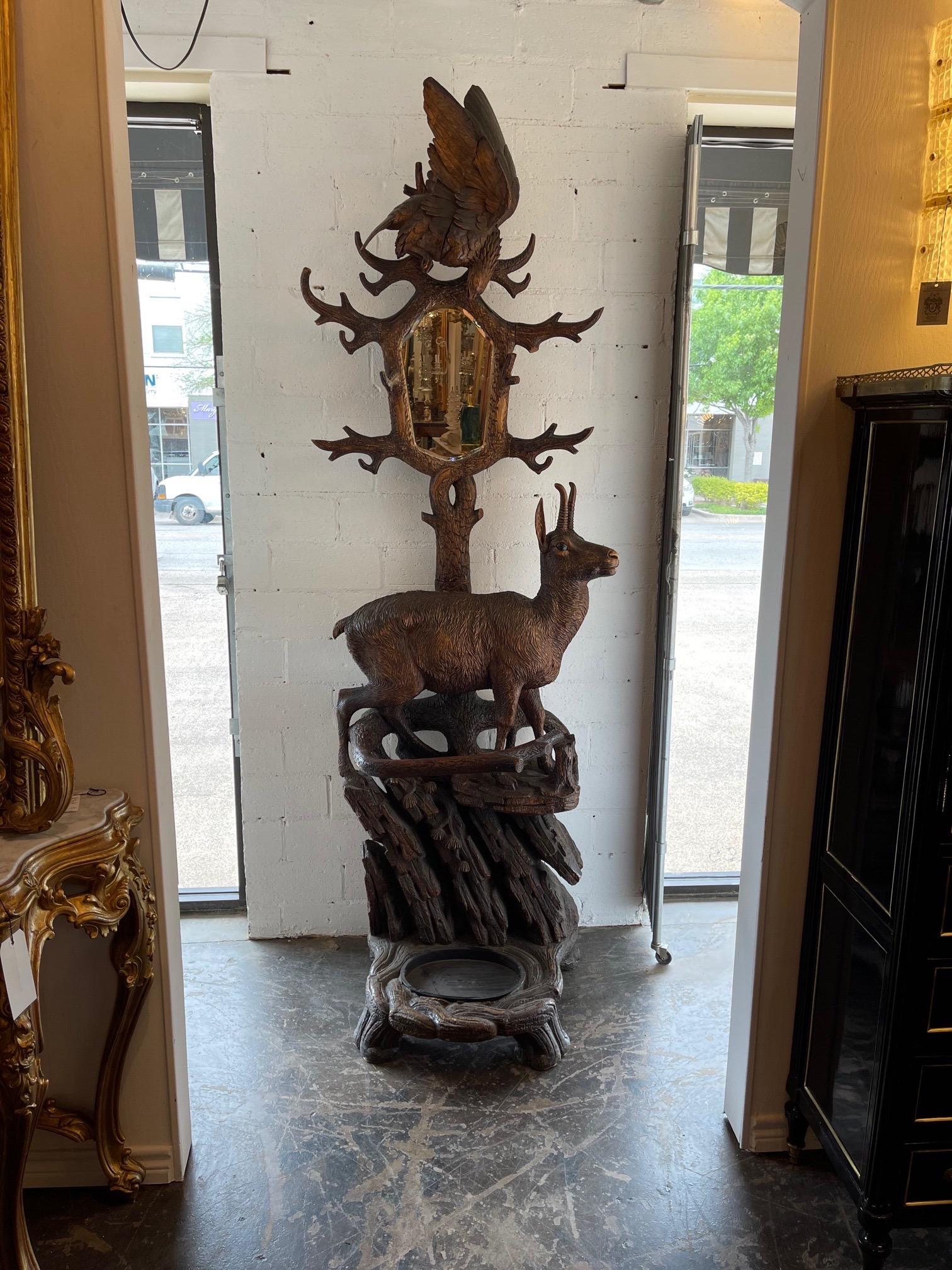 Amazing 19th century German carved walnut Black Forest hall tree featuring an antelope and a hawk. The carvings on this piece are exceptional. A true work of art!!