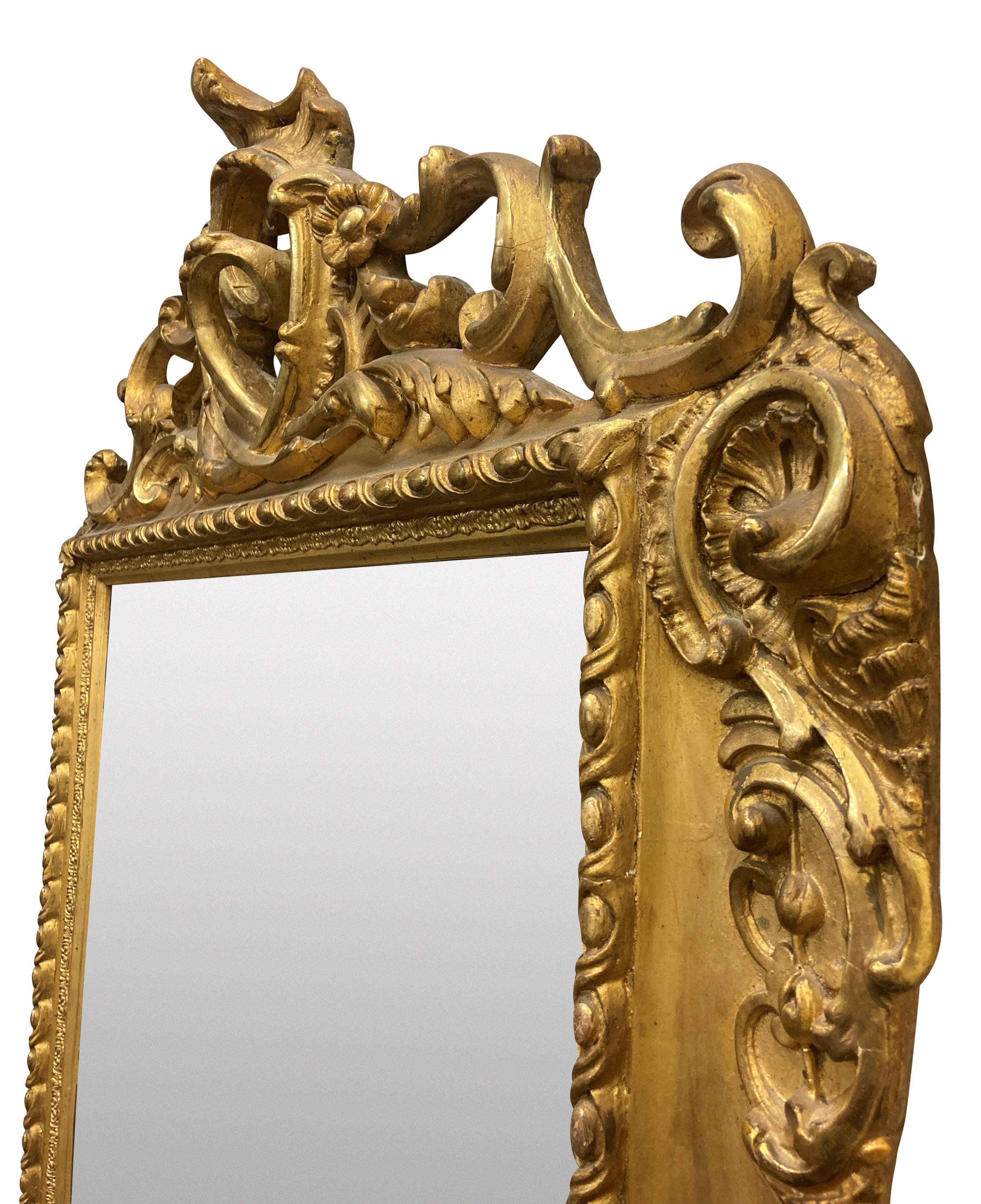 A XIX Century German carved gilt wood pier mirror, en suite with a matching console table, sold separately. Stamped 'Coburg'
