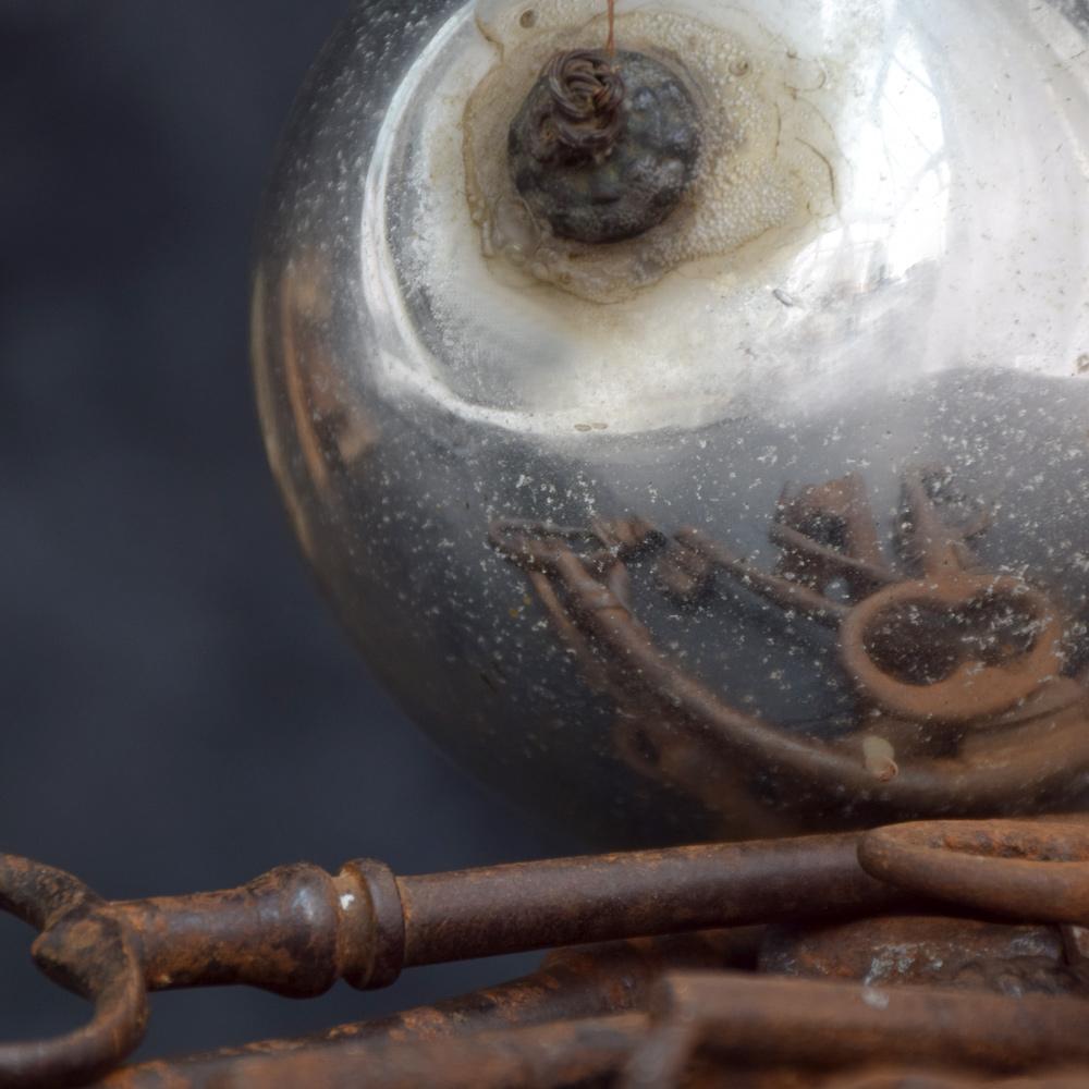 19th century glass witches ball
We are proud to offer an original mercury glass 19th century witches’ ball, originally used in parts of Europe, hung in the windows of folk who believed if a witch approached the home her soul would be captured in