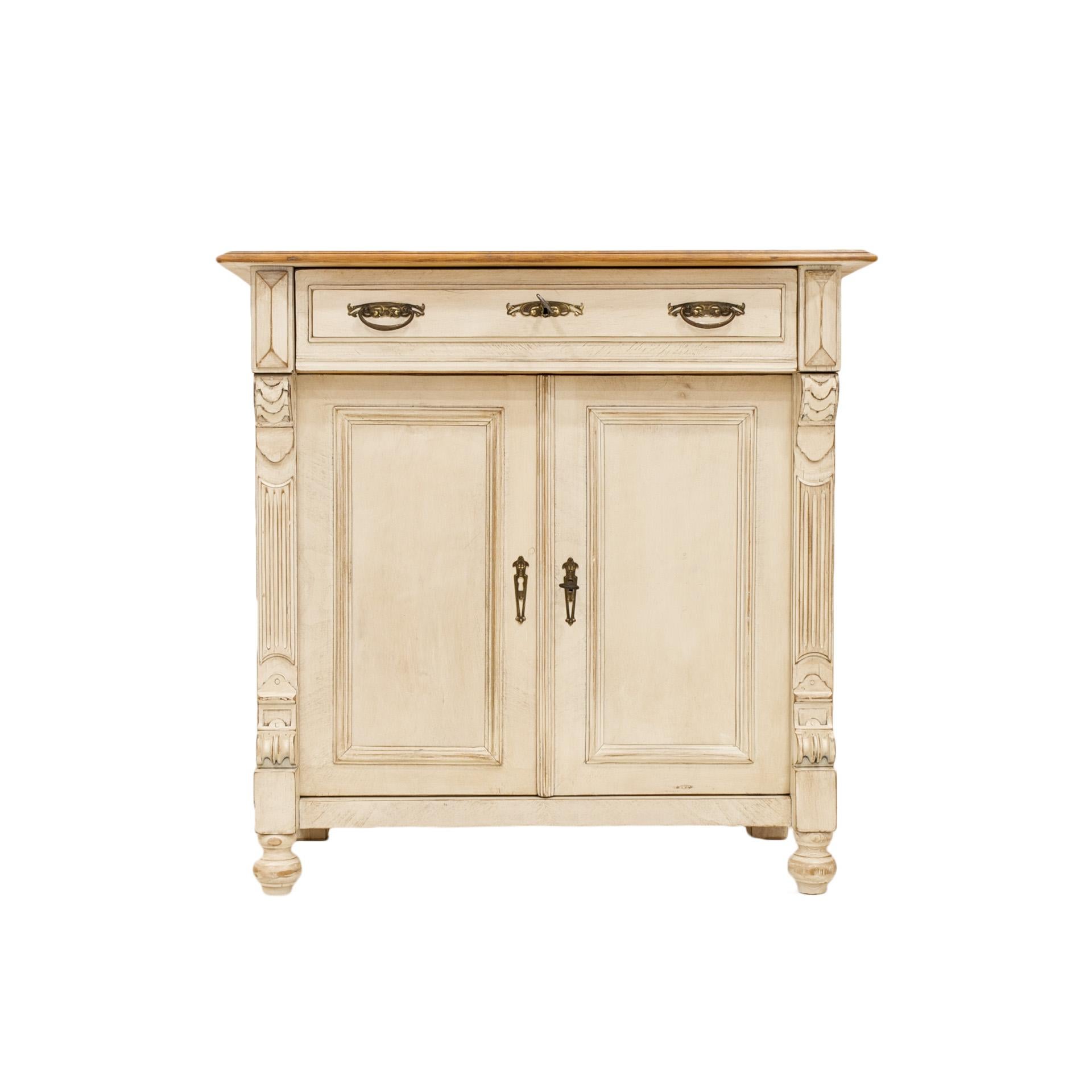 This beautiful cabinet comes from Germany from circa 1890-1900. The piece was professionally renovated and aged by using dedicated waxes. All the decor details and fittings remain original. The top is made of pine wood and was finished with