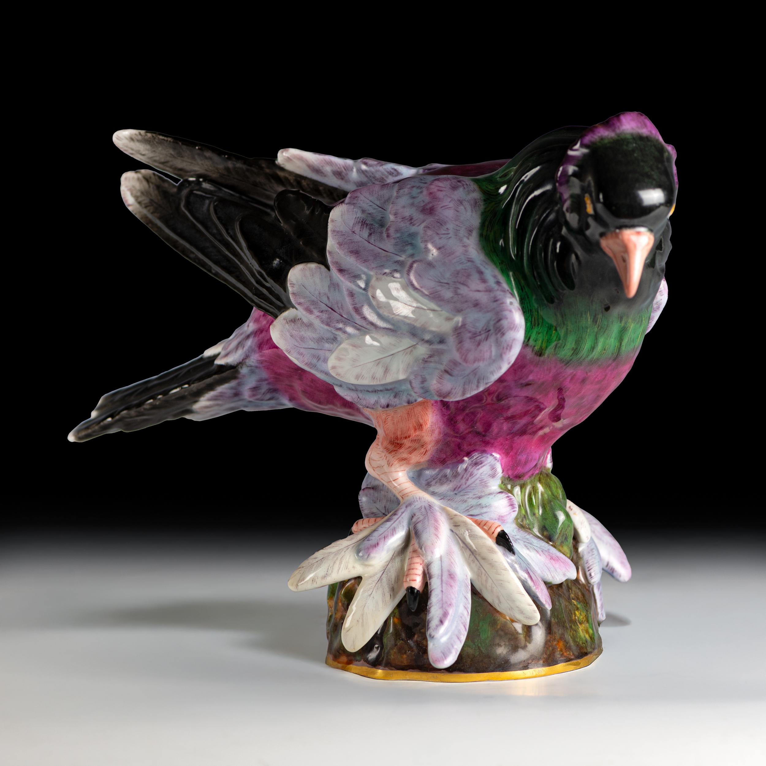 A very colorful and attractive 19th century Meissen painted porcelain model of a Pigeon, with feathered feet, on rocky base, with unglazed blue crossed swords mark to base.

Circa 1880

German

H: 8.66 in / 22 cm ; Head - Tail 12.83 in / 32.6 cm ;