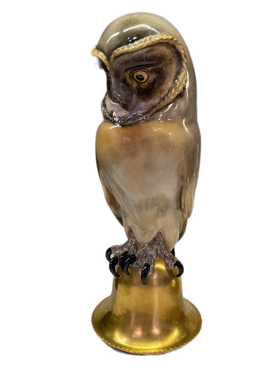 19th Century German porcelain figure of an owl, by Meissen and marked on the bottom base. The polychromed bird is perched on a gold bell shape base. The expression of the owl is very detailed, and the claws are very real.
 