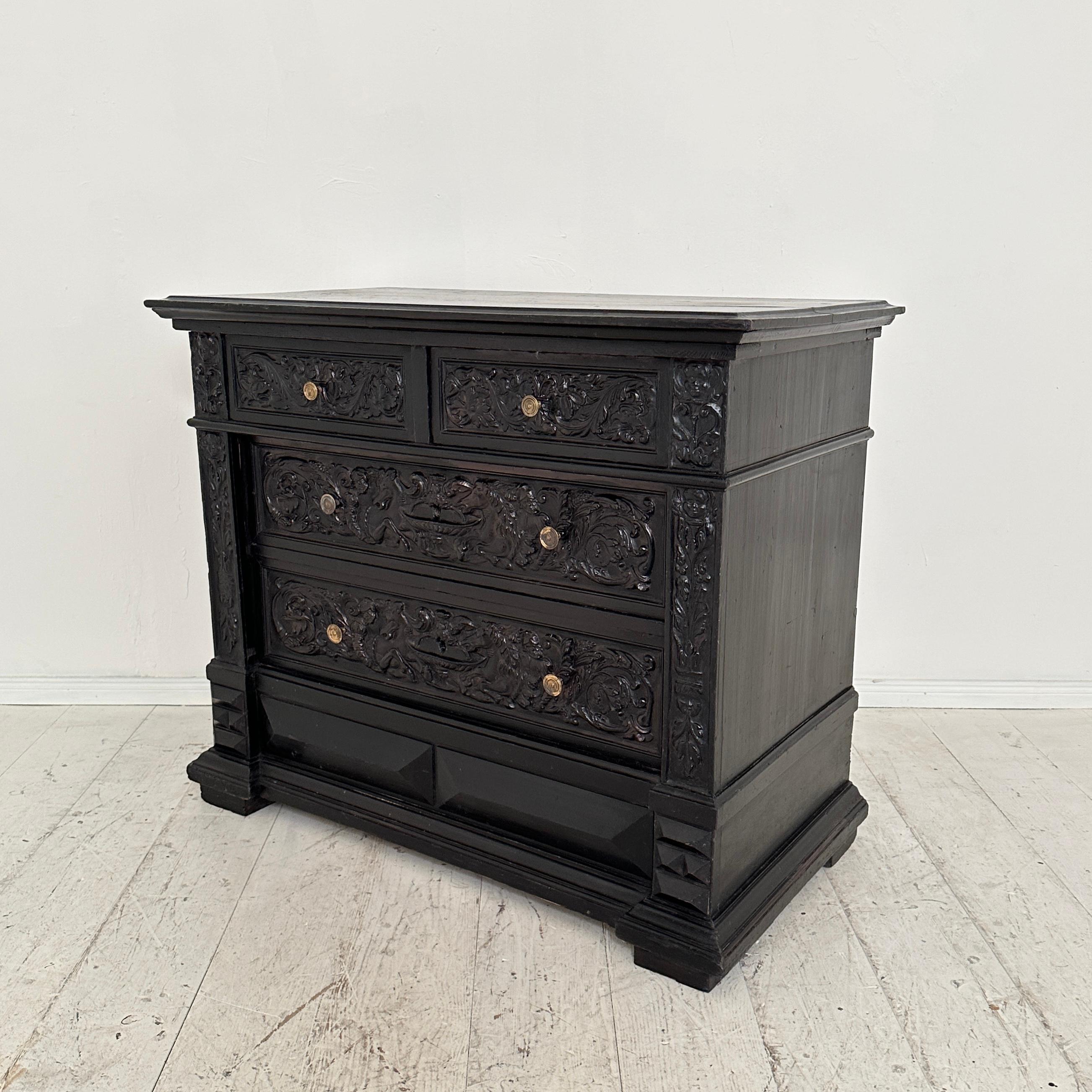 Travel through time with this exceptional late 19th-century German Renaissance-style chest of drawers, dating back to around 1880. Crafted from pine, the piece is a rare and extraordinary testament to the intricate artistry of the era. 
The chest's