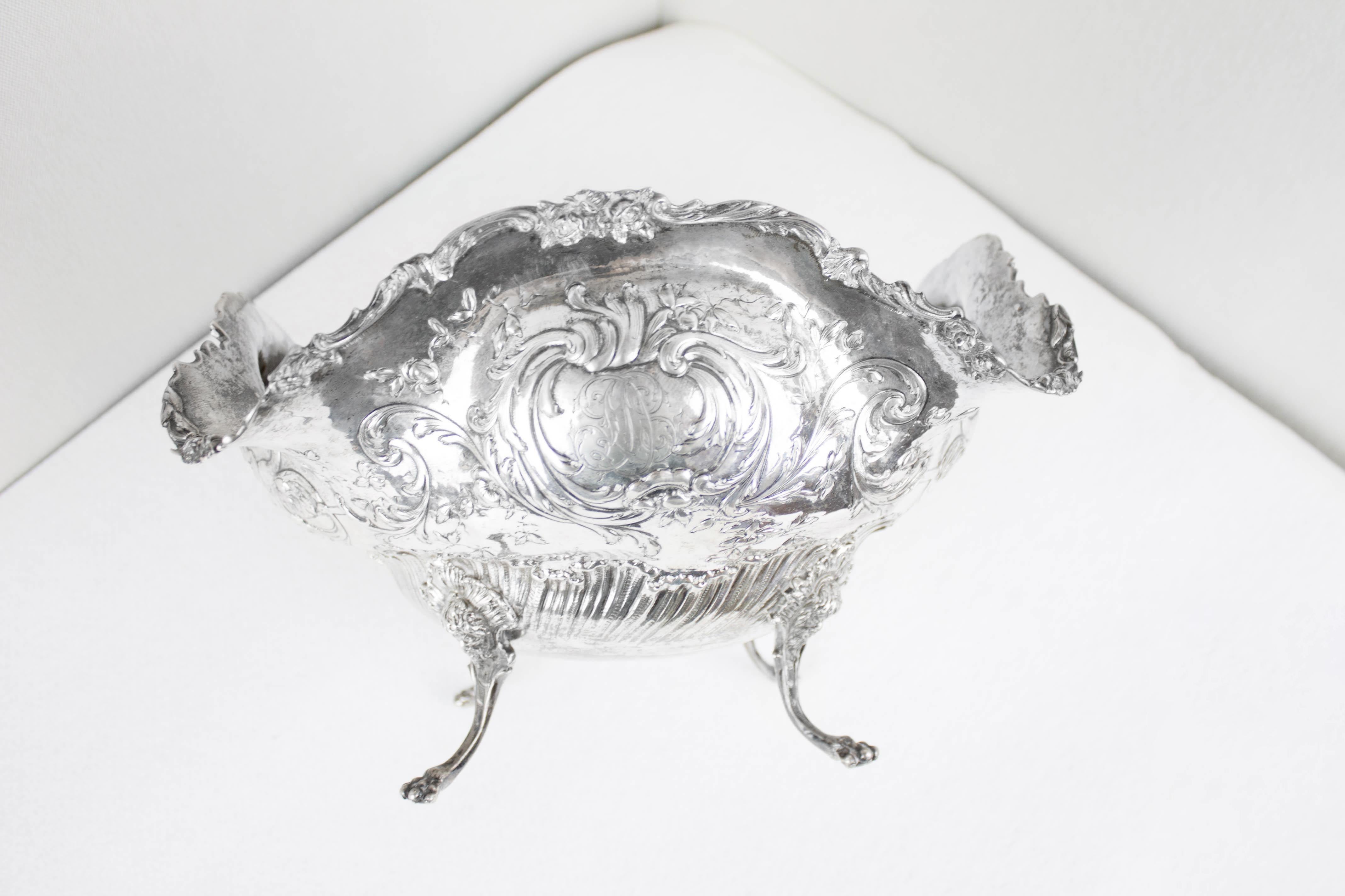 Elegant embossed centerpiece with four feet lion-shaped paw shape with engravings of letters inside the emblem. German hallmarking system was unified in 1888 (see Decree January 7, 1886) adopting the national mark 