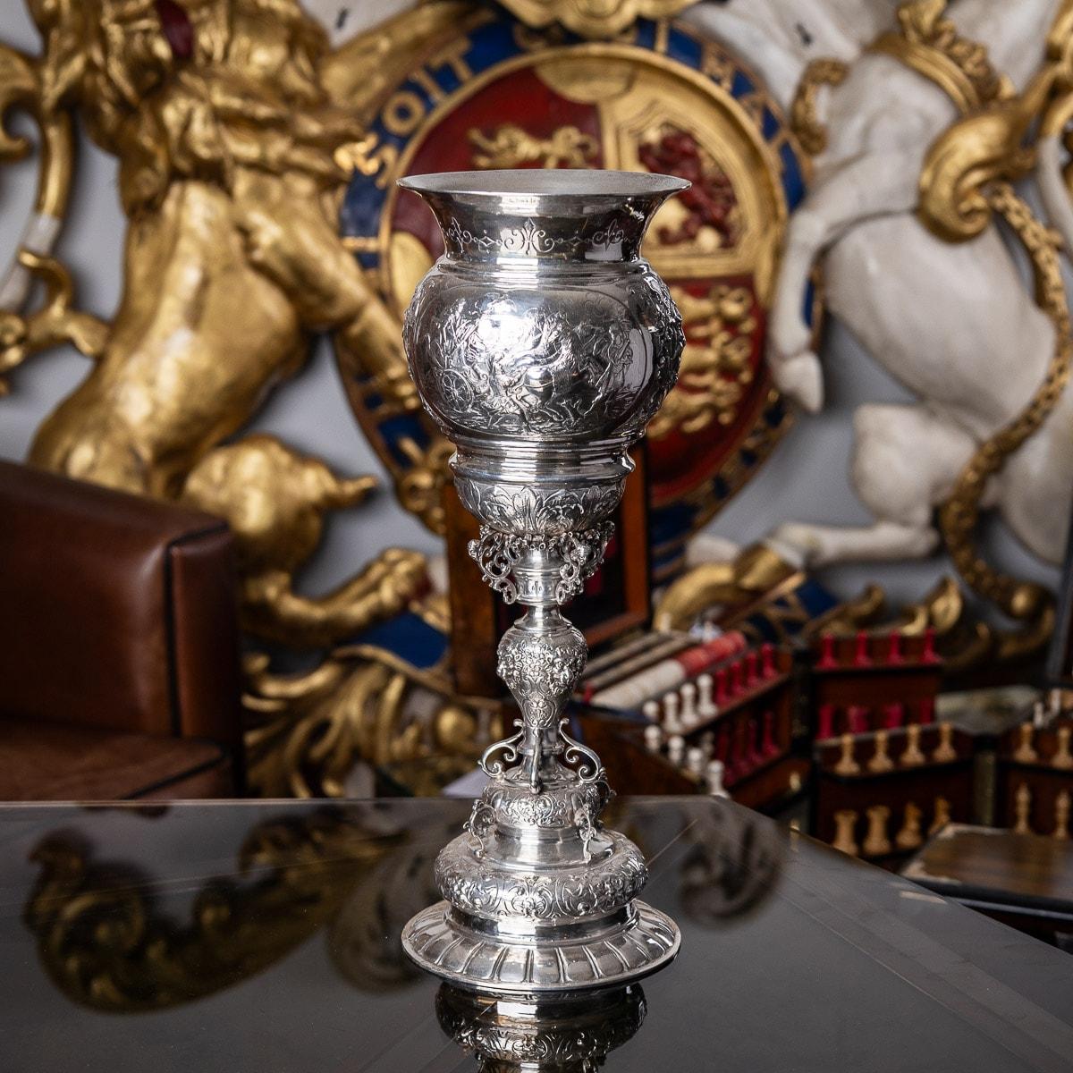 Antique mid-19th Century German solid silver goblet, made in the style of the early-17th Century examples, which were originaly made in Augsburg and Nuremberg. The piece beautifully embossed with scrolling foliage, panels depicting mythological