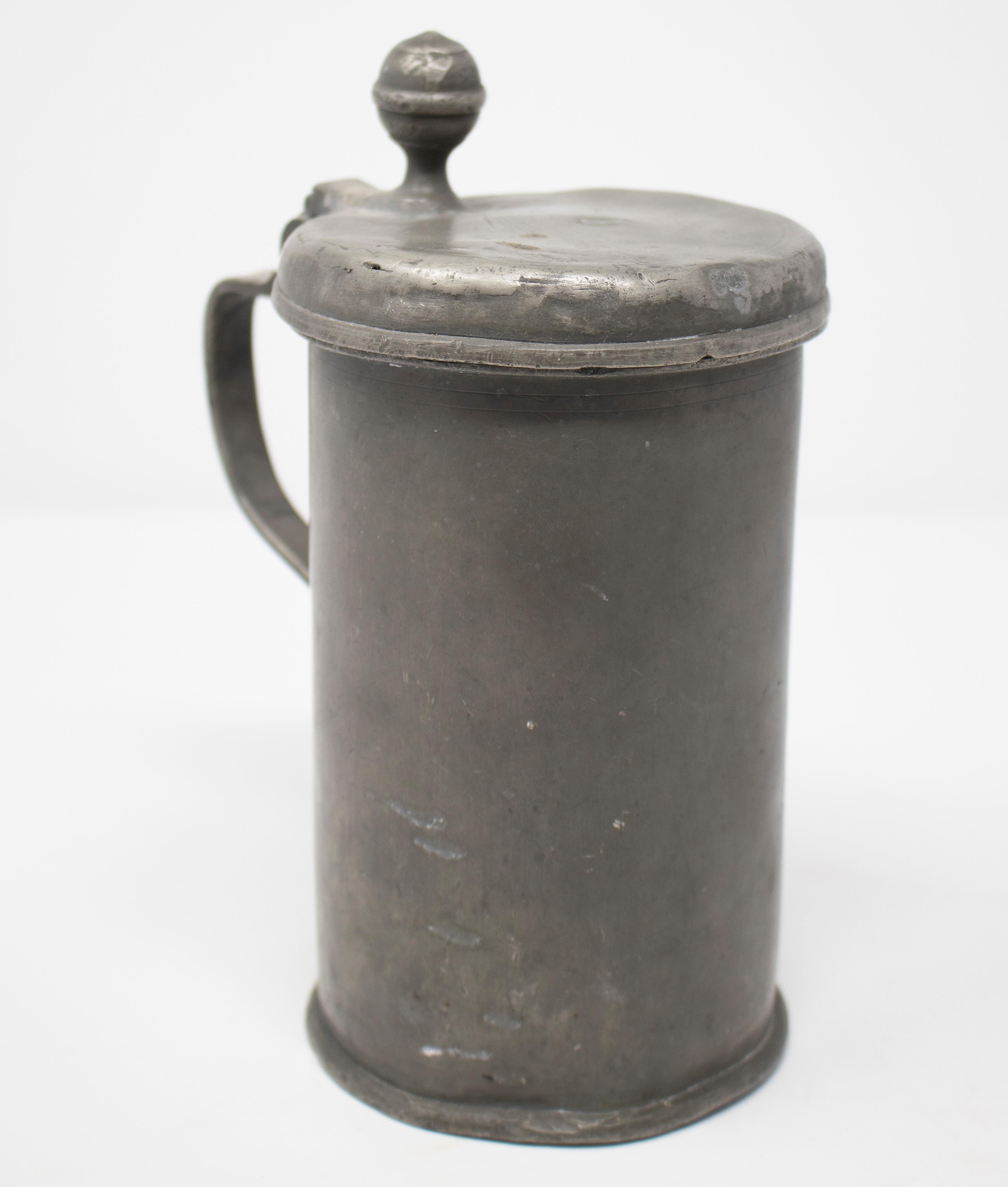 19th century German tin beer mug with lid.