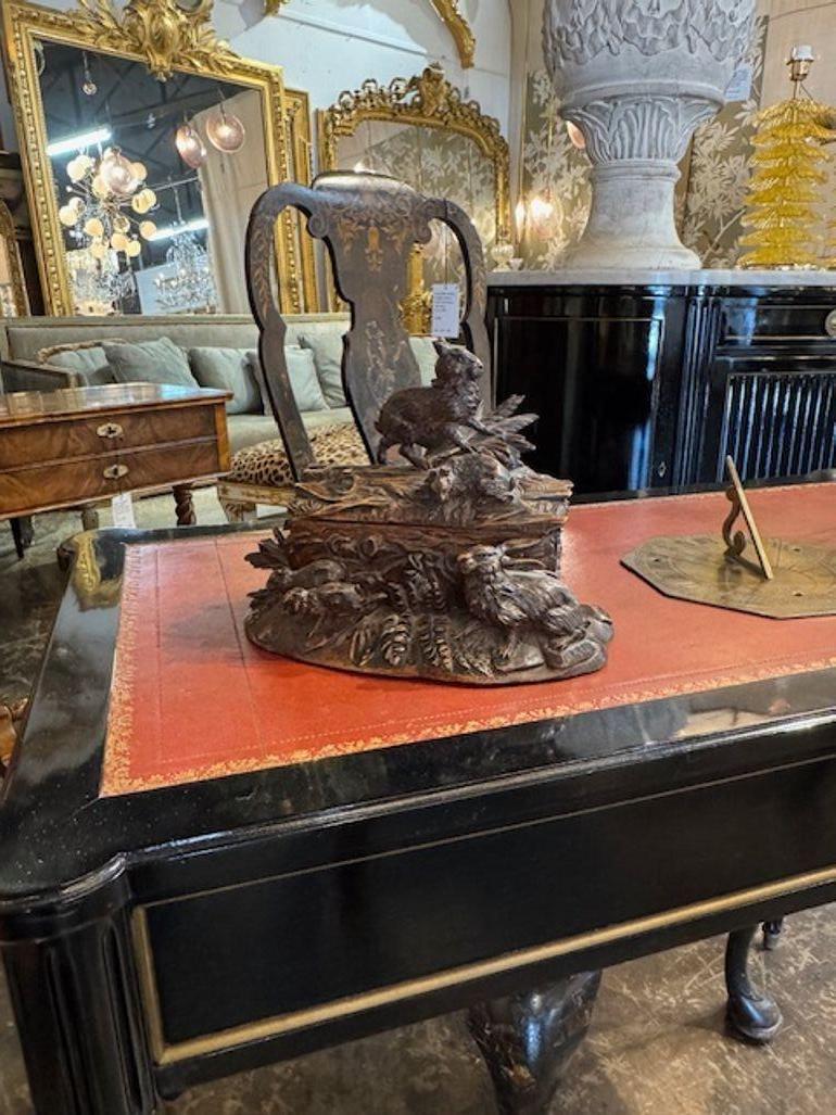 This 19th Century German walnut Black Forest box features a charming design with rabbits. The box is meticulously crafted with intricate details and showcases the skilled artistry of the era. Made in Germany, this decorative collectible exemplifies