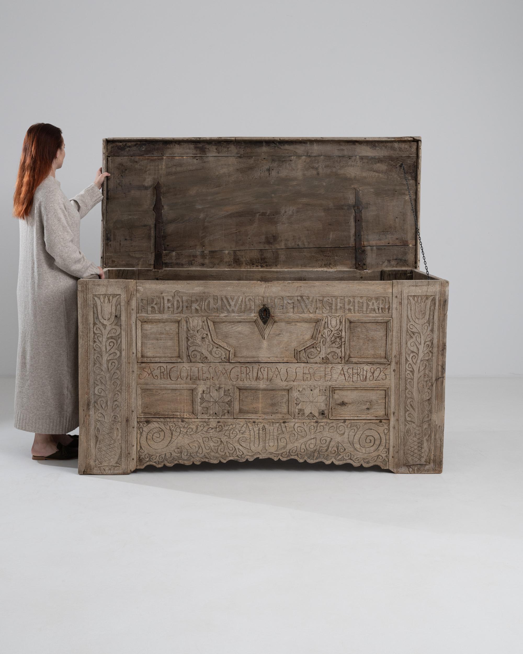 A wooden trunk from Germany, circa 1823. This enormous trunk is scrupulously carved from head to toe with a horror vacuii sensibility. Carved with the former owner’s name, the lettering as well as star and floral motifs emit both a majesty and a
