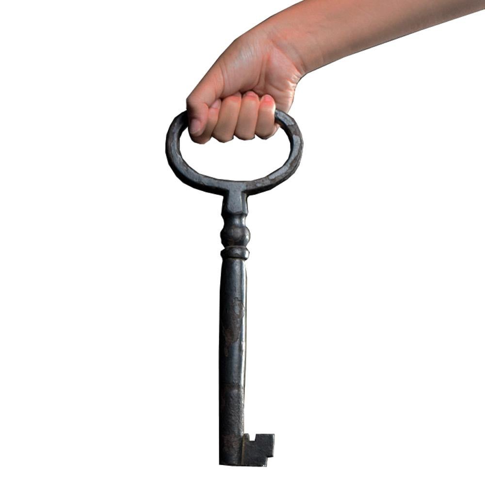19th century giant key 

An original 19th century unusual oversized wrought iron key, we’ve never seen the like at this size, with a naturally aged surface with loss in areas, if you think the key is big, can you imagine the size of the door it