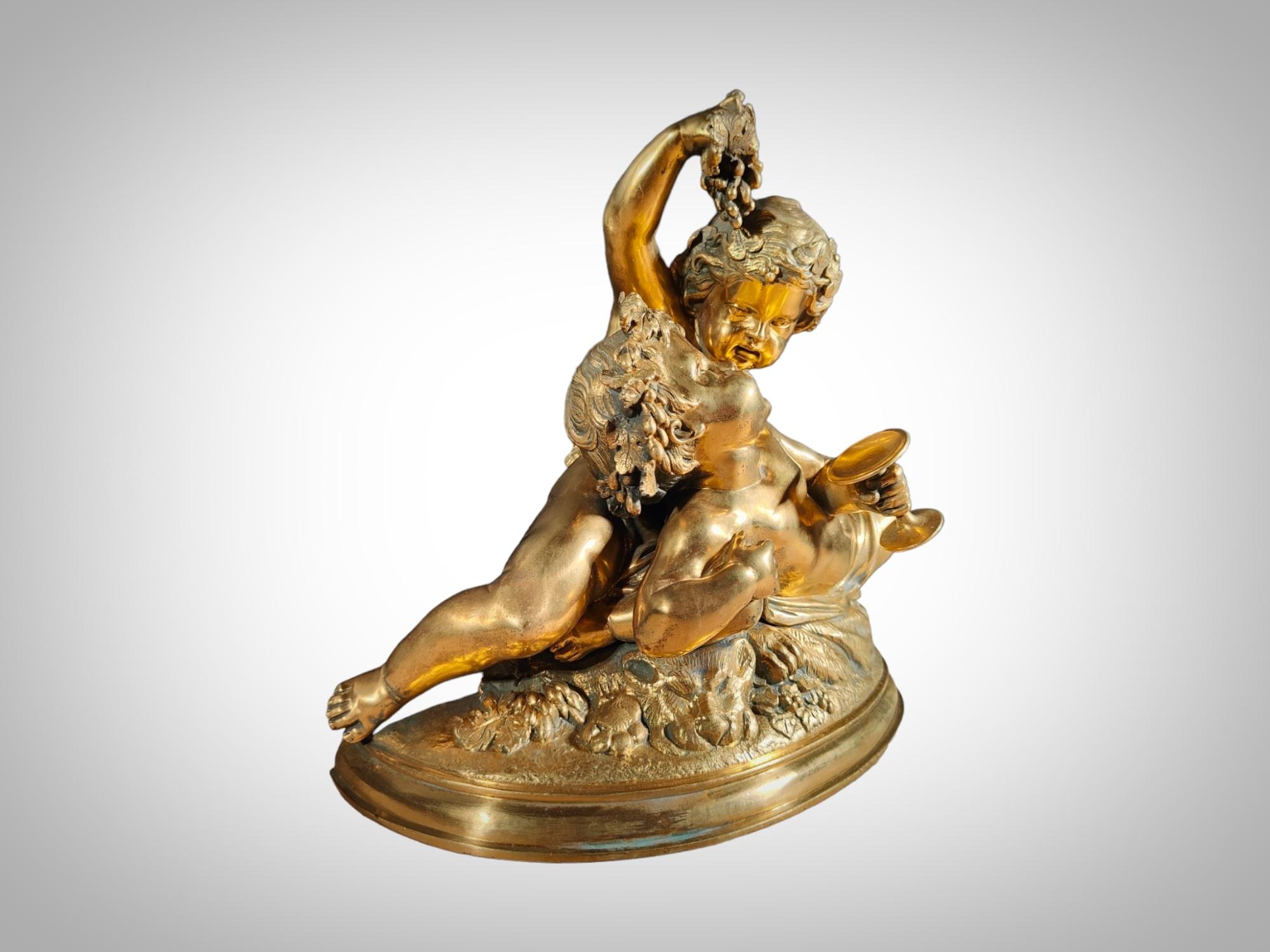 Immerse yourself in the elegance of the 19th century with this refined gilded bronze sculpture depicting the allegory of the harvest. The piece features two children enjoying grapes, capturing the essence of art and life from that era. In excellent