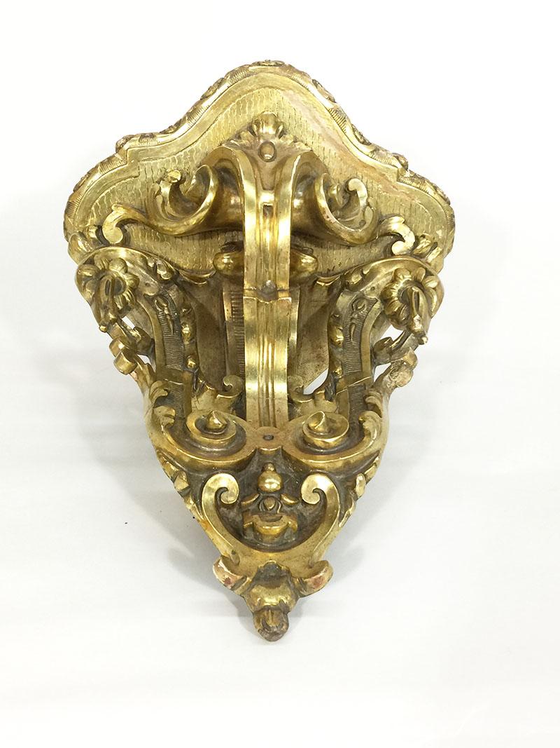19th Century gilded corner wall bracket

Corner wall bracket made of wood, plaster and gilt
France 1840-1860

The measurements are 30 cm high, 28 cm wide and the depth is 24 cm
Shows some age ware, see details in the pictures.