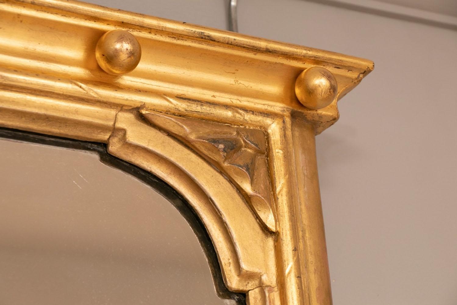 English antique giltwood overmantle mirror, circa 1880. Superb quality 23.5-carat genuine gold leaf gilding. Original mirror plate with little foxing, original backing boards and hanging plates.