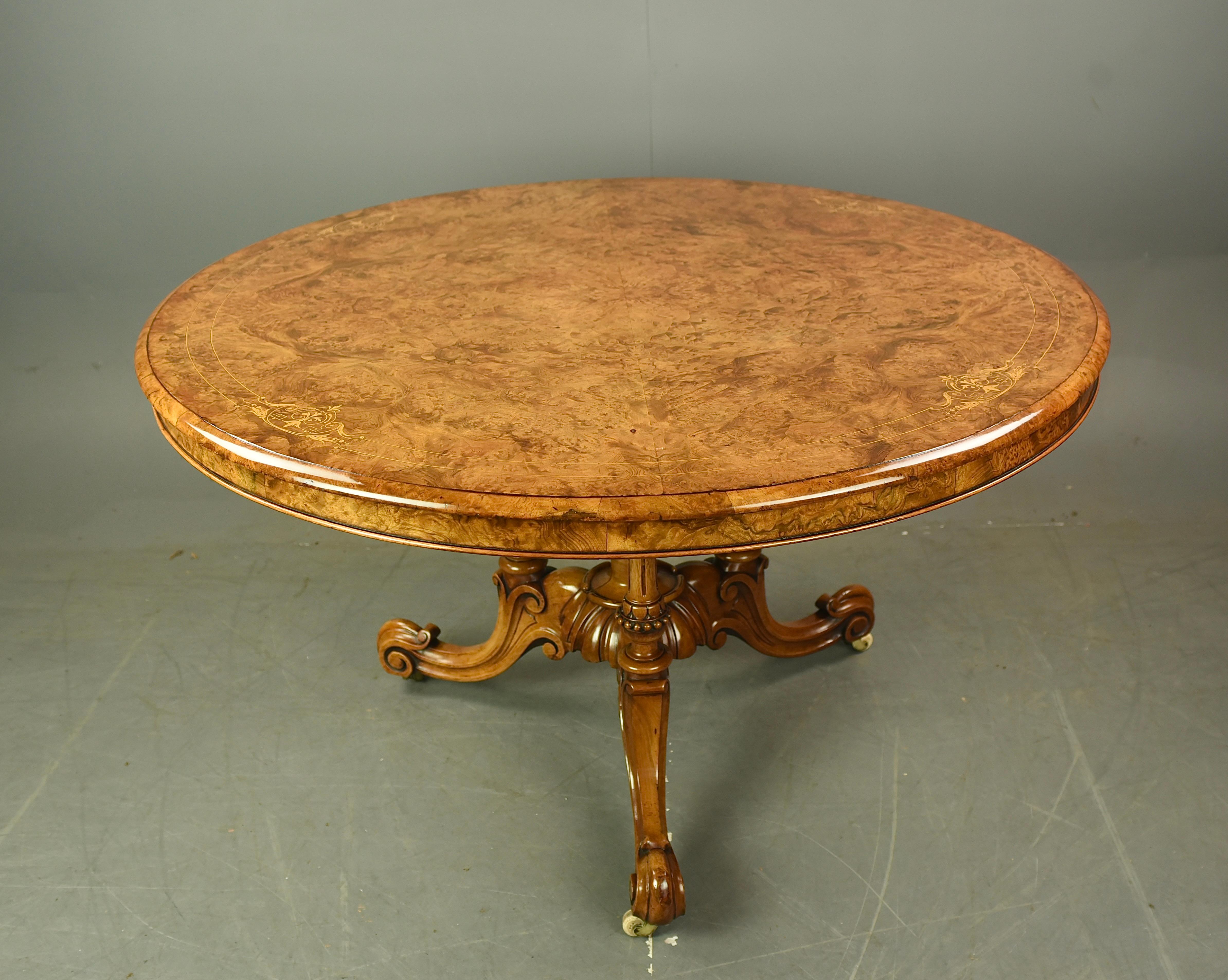 Fine quality burr walnut circular breakfast /centre  table with fine inlay attributed to Gillow .
The top is quarter veneered on mahogany that has a fantastic grain and colour with fine inlay detailing that is a tilt top action with a brass  catch