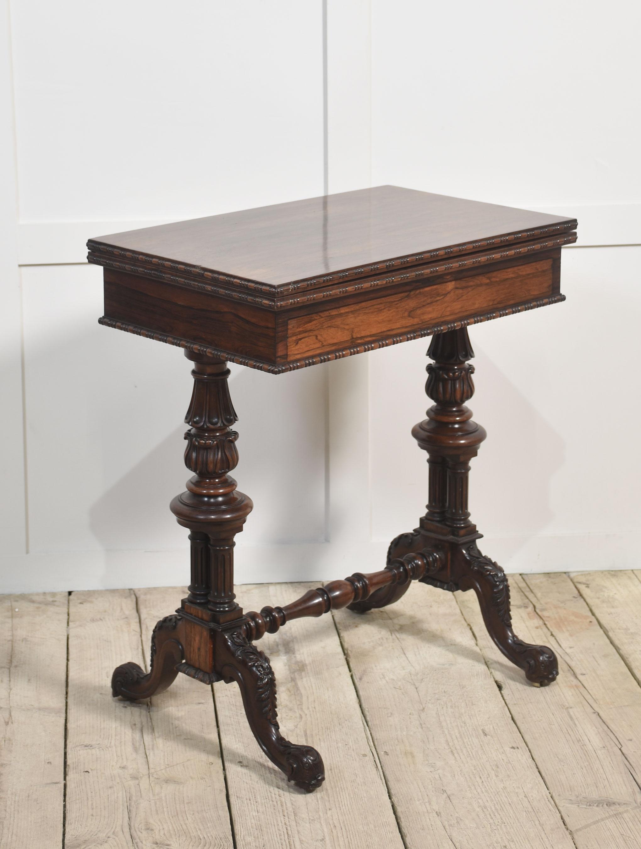 19th-century Gillows design card table The well figured hinged top opening to revealing an oval inset baize interior above a shallow moulded frieze fitted with a pull-out drawer. Standing on a good Gillows design, carved gadrooned moulded base with