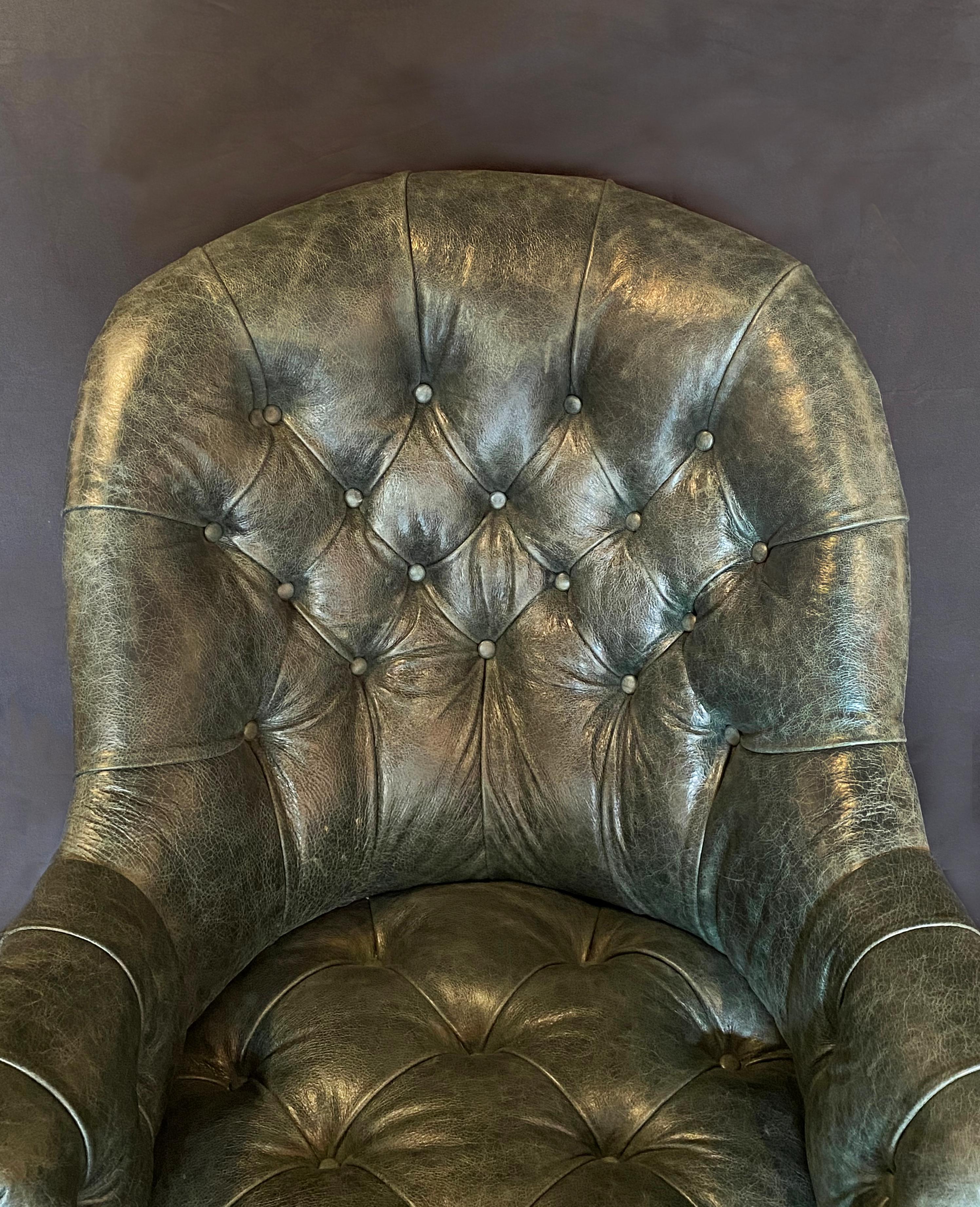 A 19th century Gillows of Lancaster walnut and leather upholstered library arm chair, with exceptional overall condition and colour. The button down deep green leather is in perfect condition and luxurious. The walnut arms have scrolled carving and