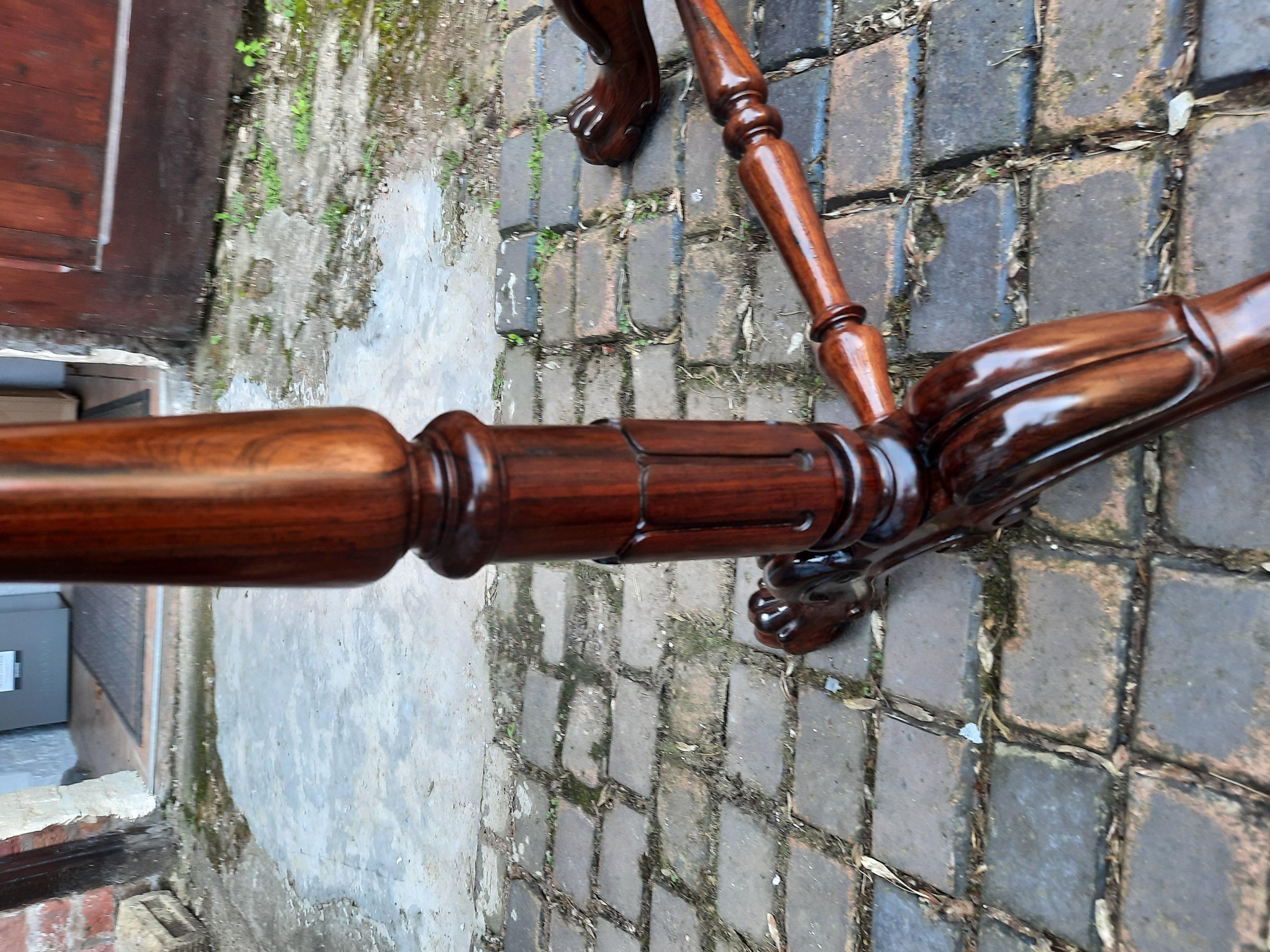 19thC Gillows rosewood turnover top games table, with green baize lined interior, with turned and carved supports, centre stretcher and downswept legs terminating in claw and paw feet - 28