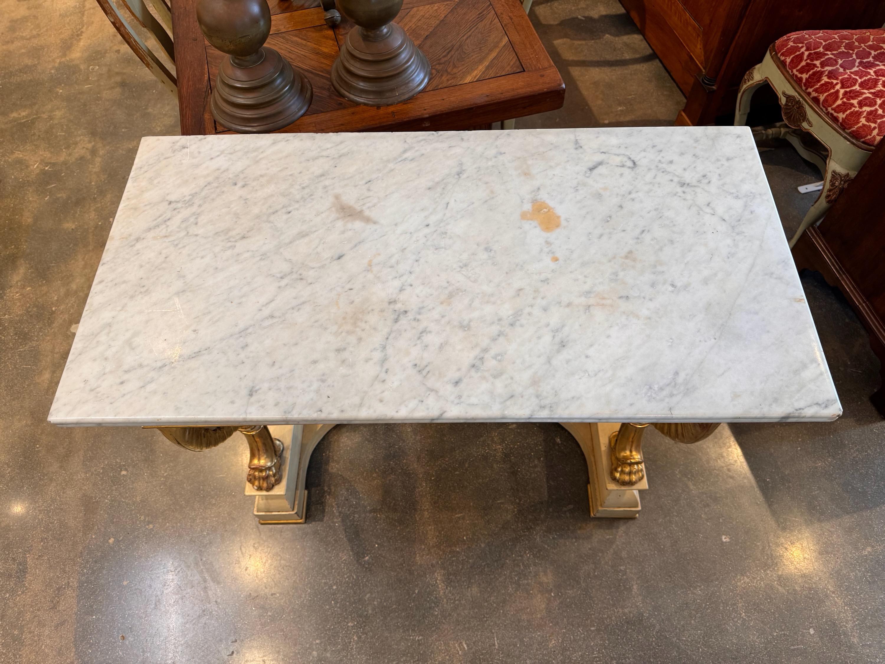 A paint and Giltwood French console. Marble top