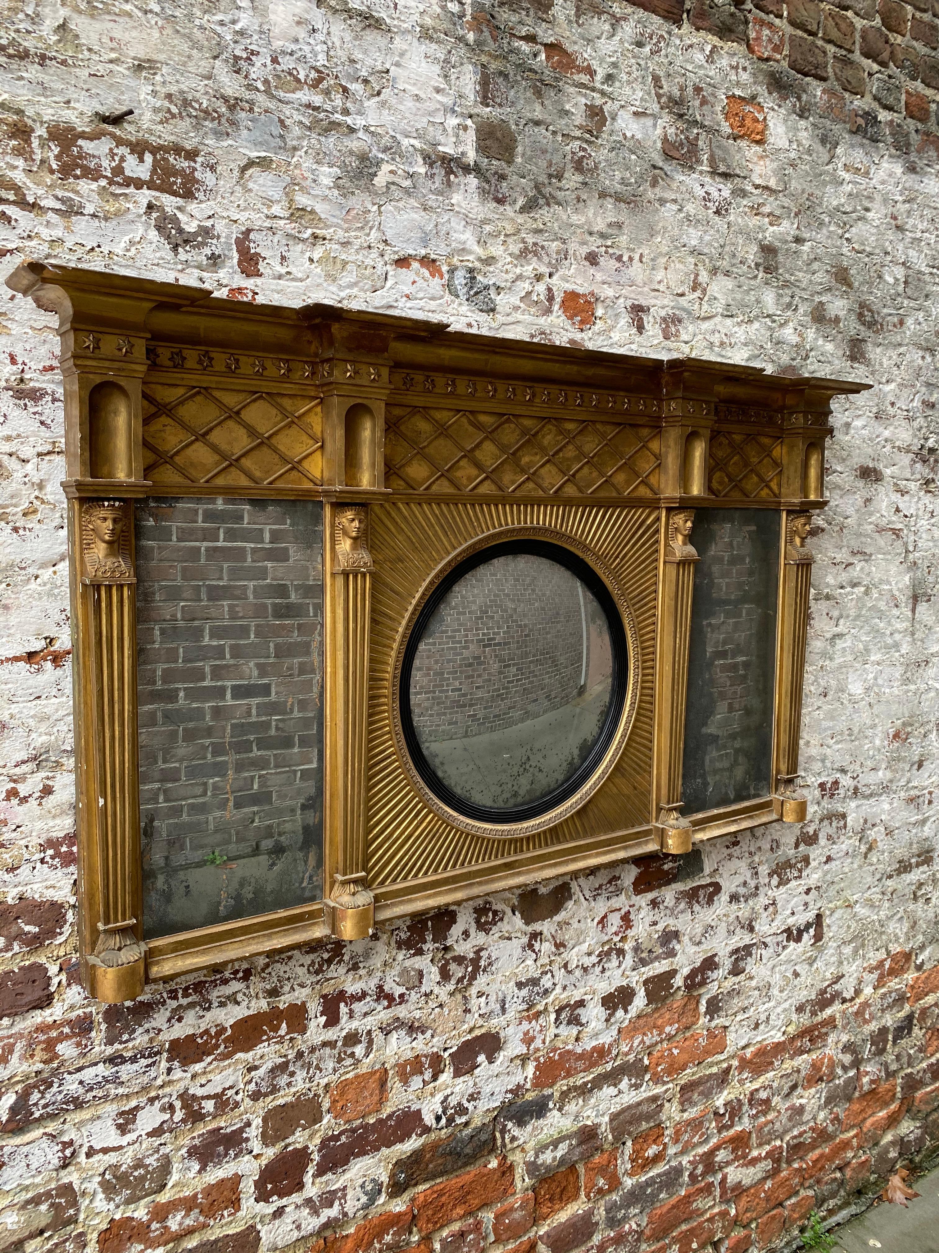 19th century gilt and wood carved English overmantel mirror with Egyptian motif.